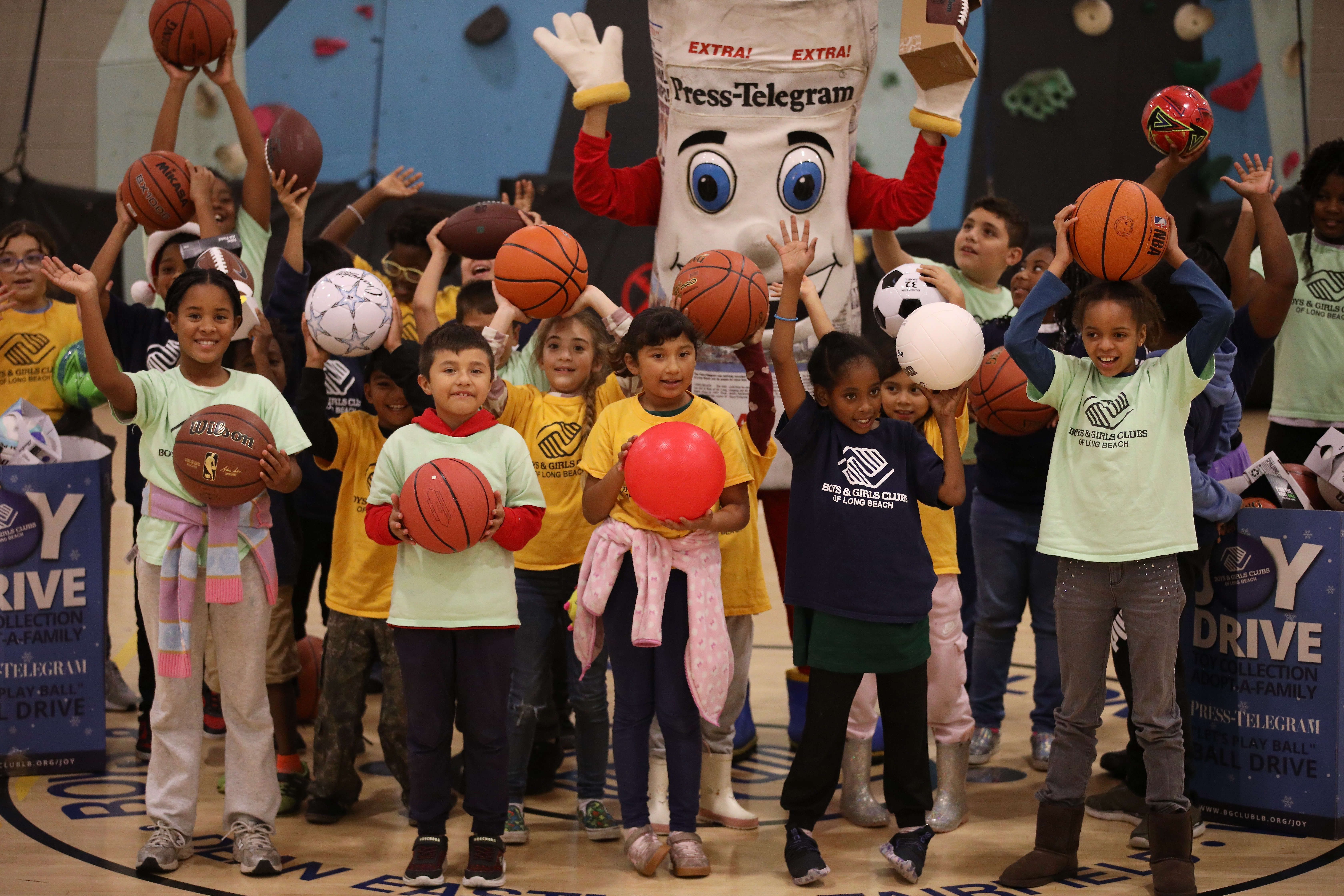 Members of the Long Beach Boys & Girls Club display...