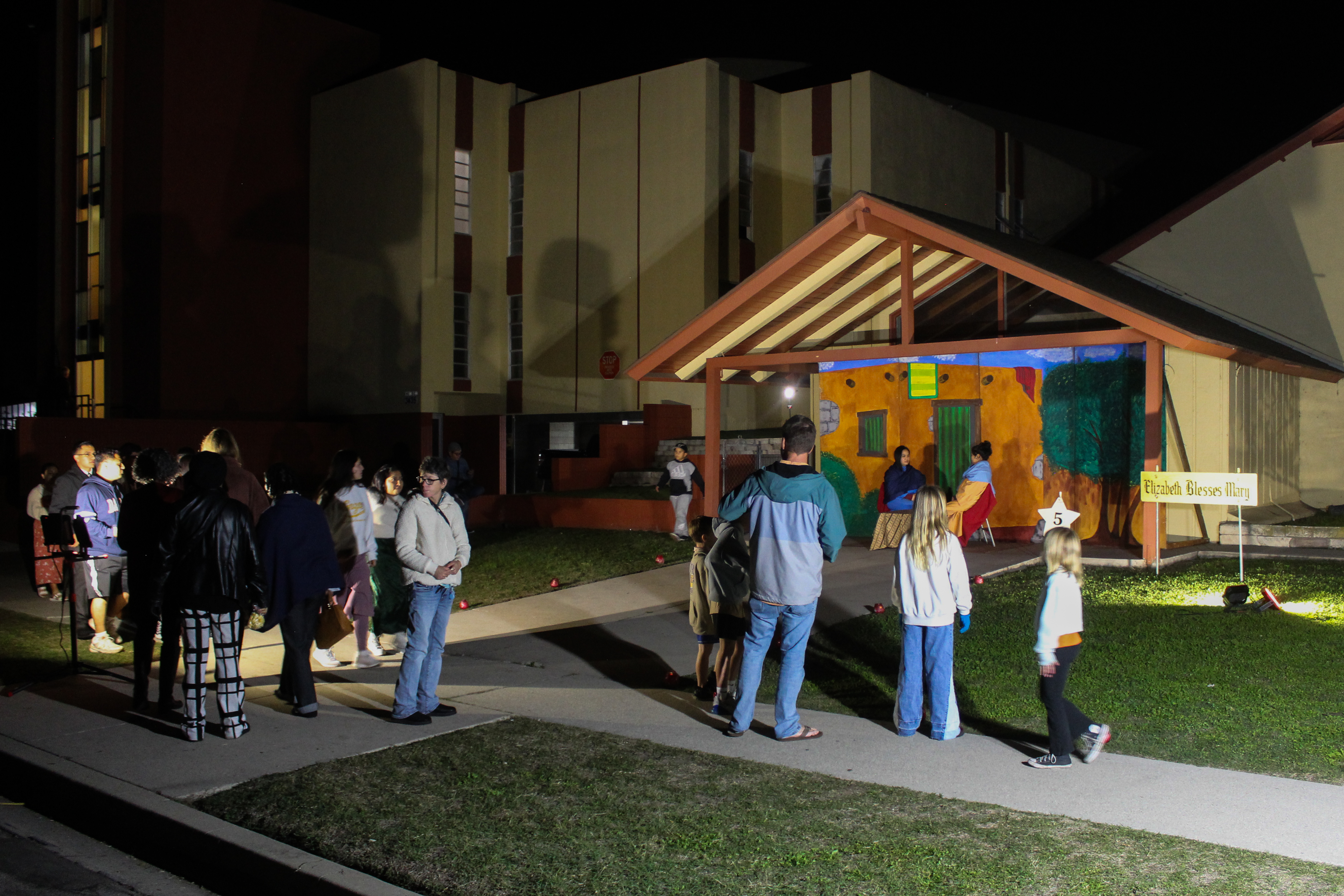 Visitors check out nativity scenes and scripture readings on display...