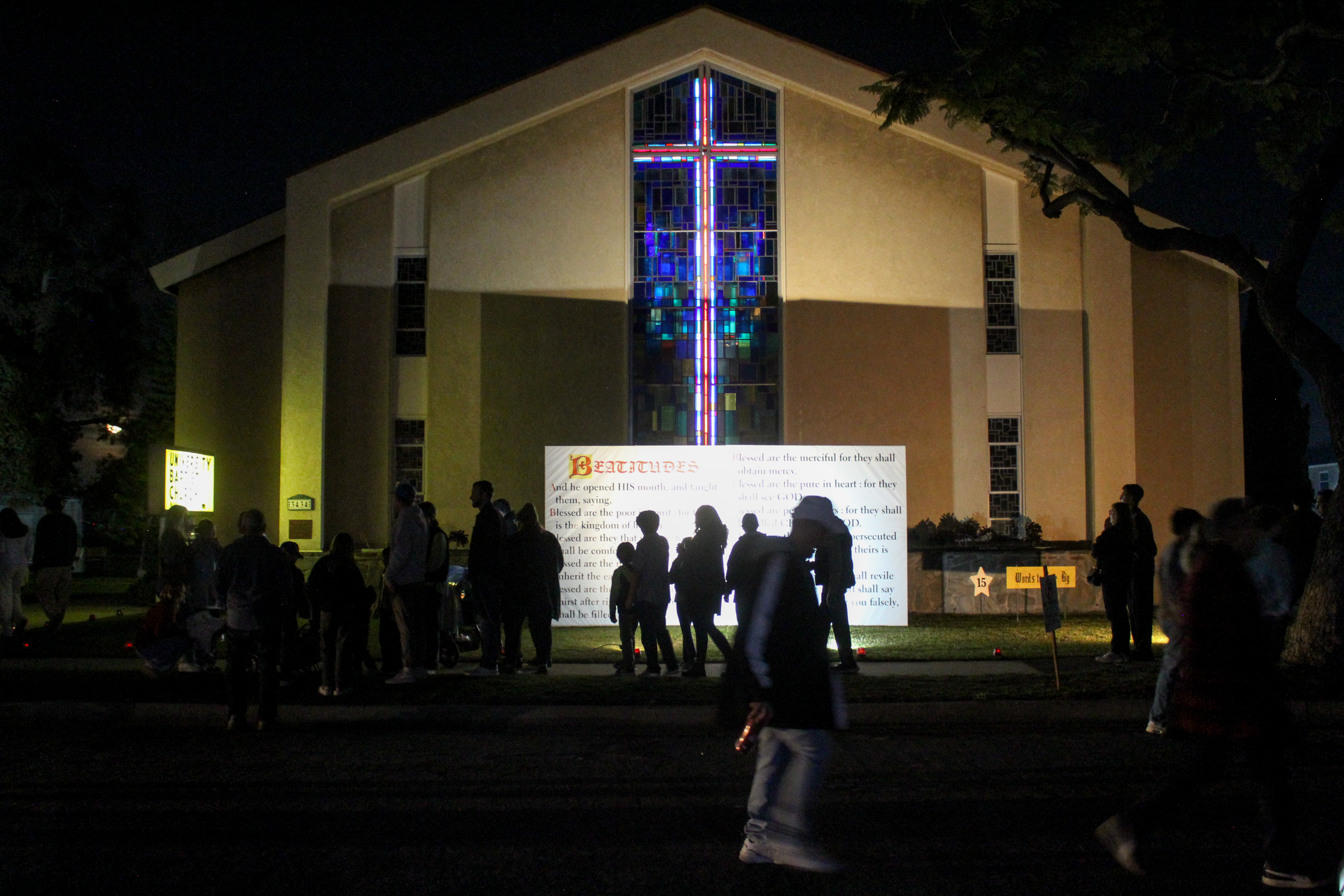 Visitors read the Beatitudes displayed at the Portraits of the...