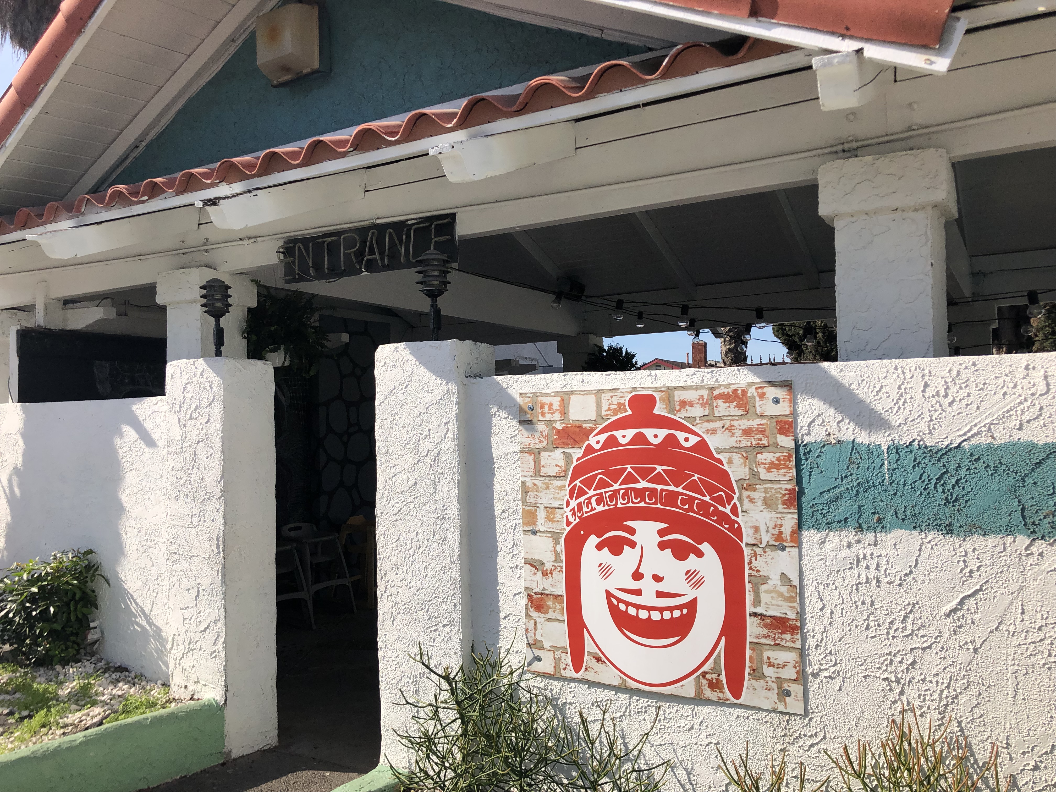 A friendly face welcomes diners to Casa Chaskis in Long...