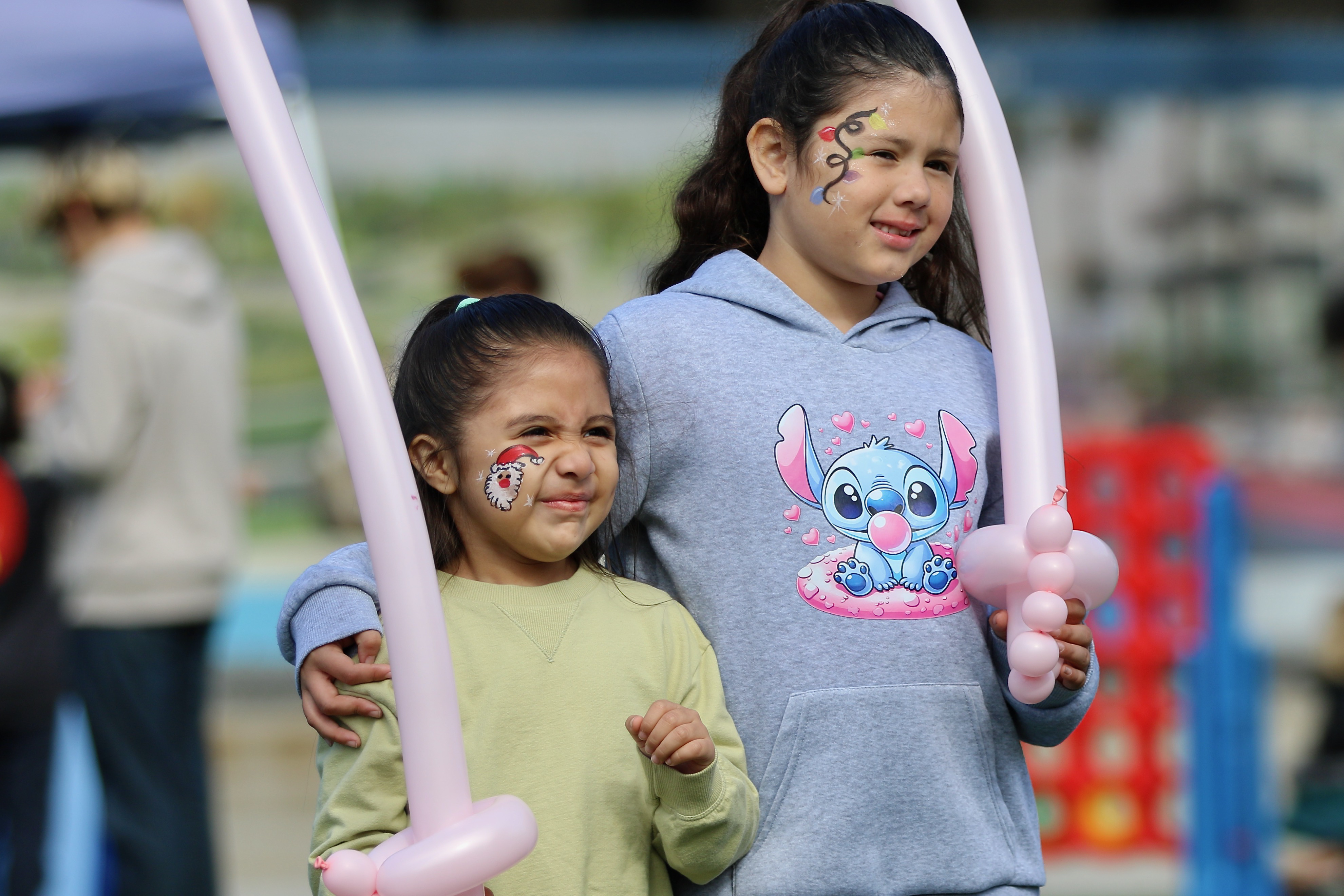Young revelers celebrate the holiday season at Winter Fest on...