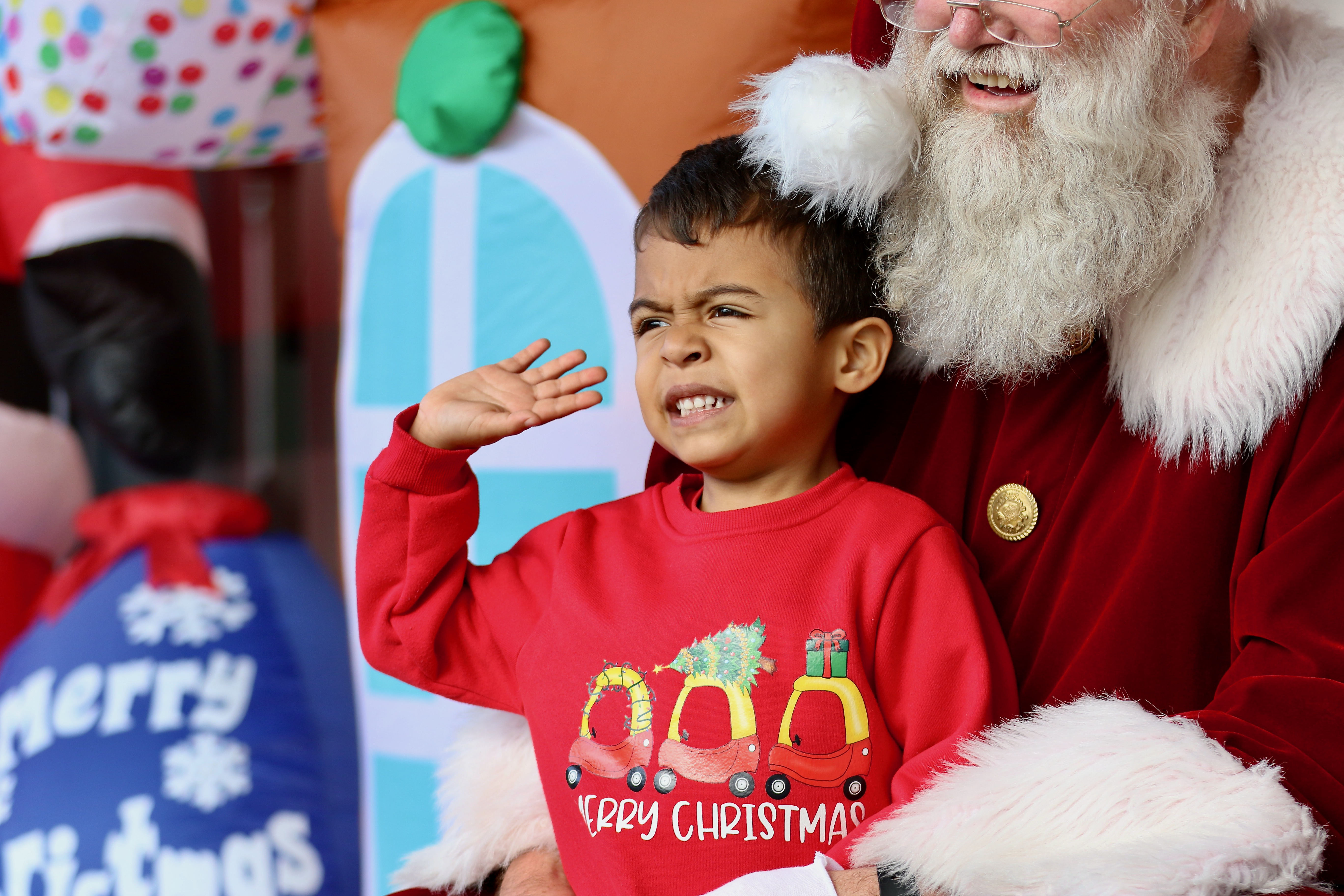 Keoni Franks, 4, waves to his parents during a photo...