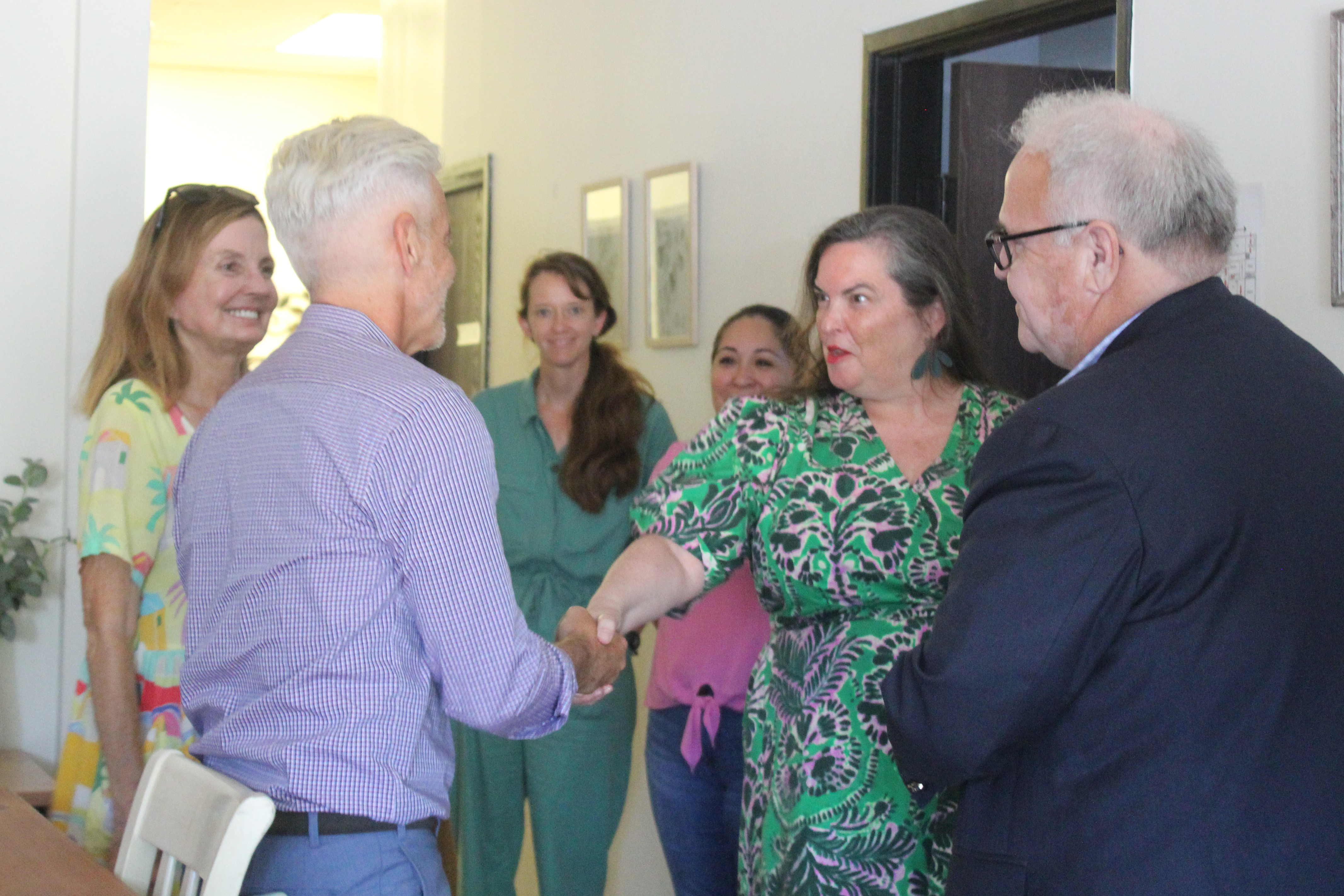 Assemblymember Josh Lowenthal speaking with board members and staff of...