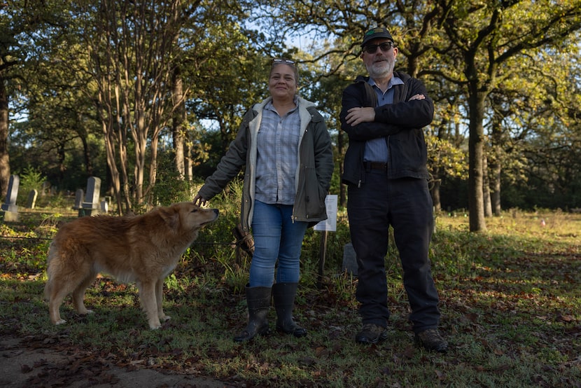 (left to right) Rusty, Monica Newbury and Michael Puttonen pose for a portrait in front of...