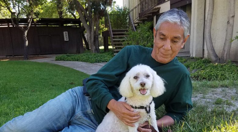 Manny Cruz with dog Miles. (Photo courtesy Rick Griffin/MarketInk)
