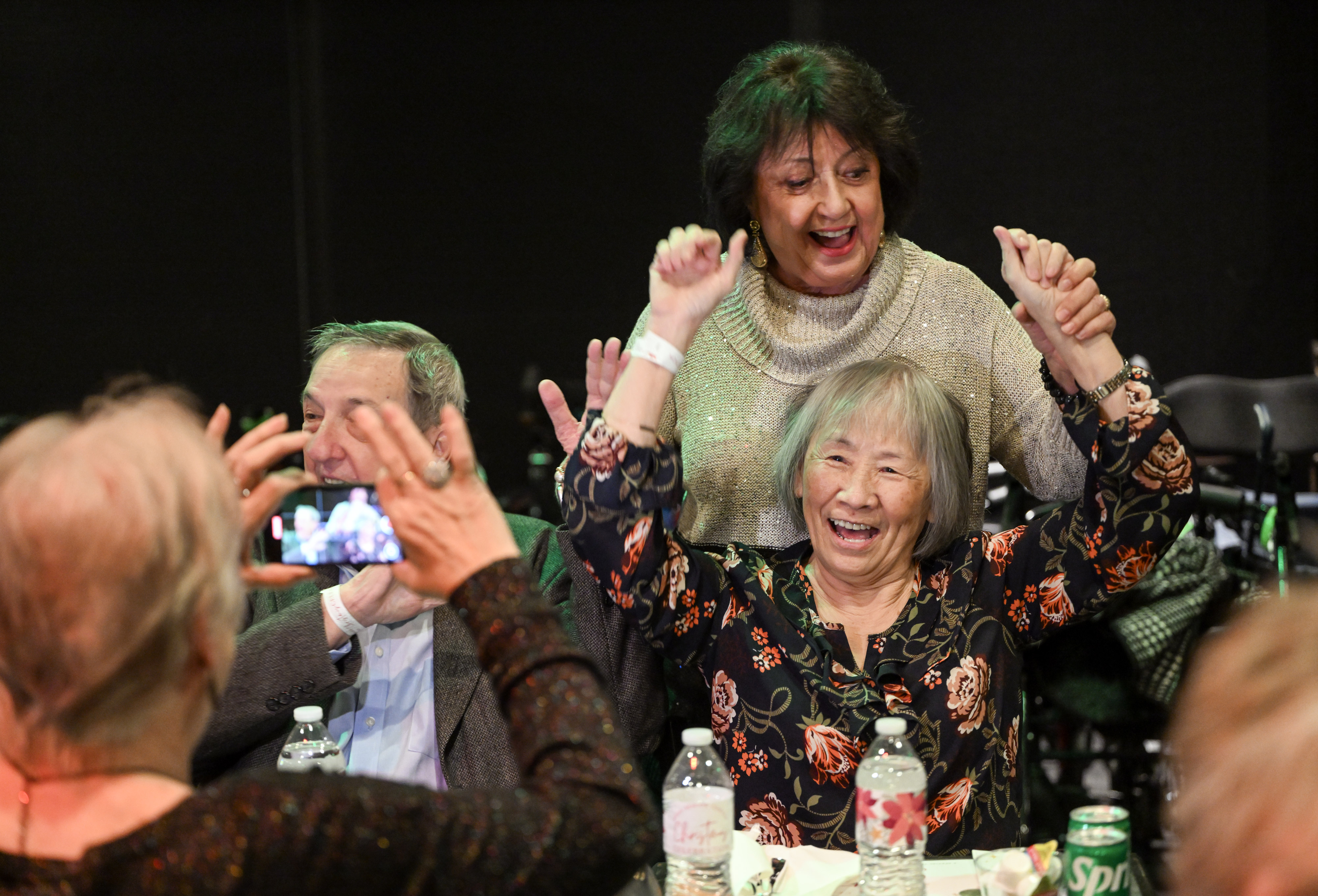 Carol Innes, standing, dances with Li Rish as Janet Wylie...