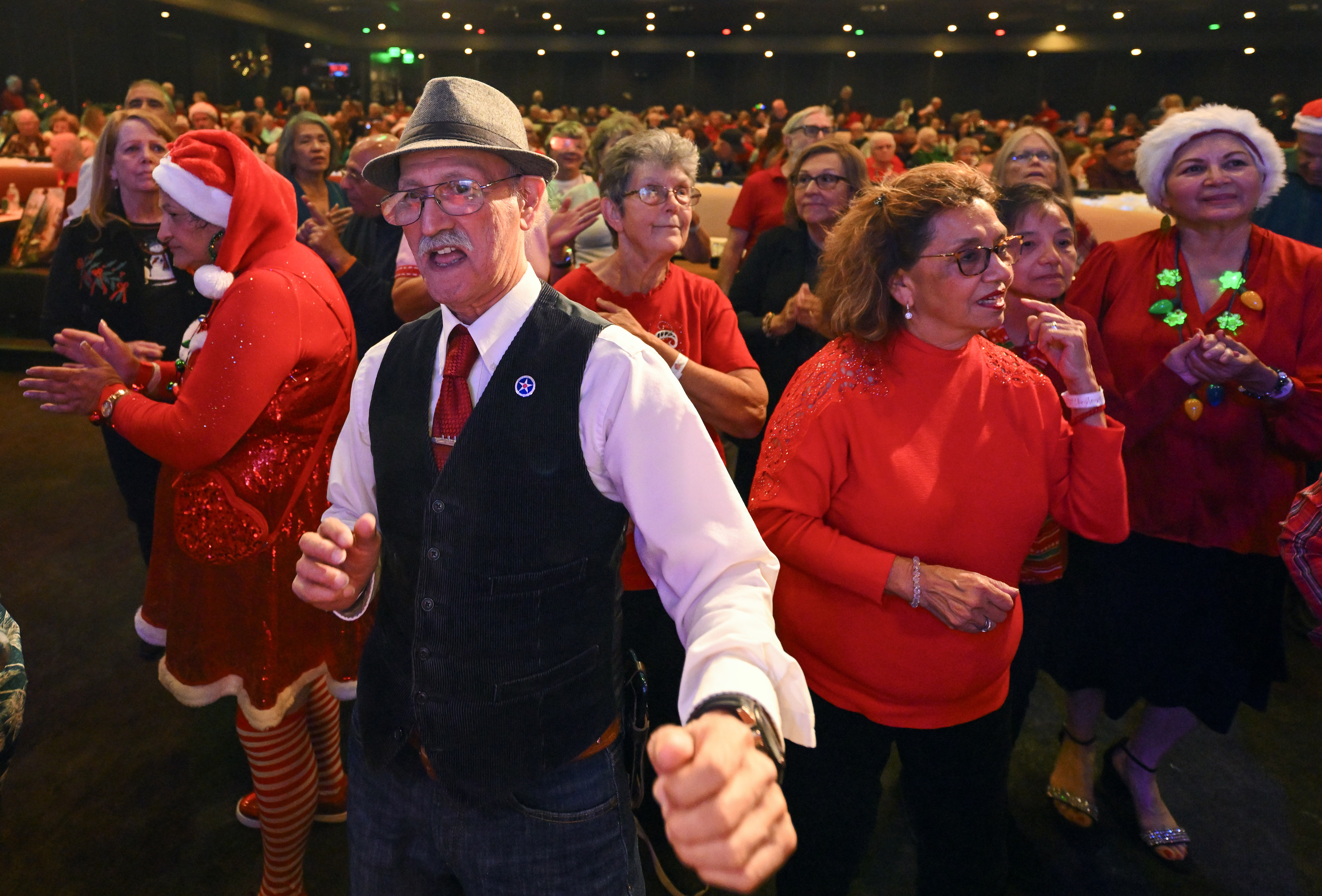 Trini Cisneros dances during The Annual Brea Senior Center Christmas...