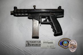 An assault-style firearm was found in the grass near a 19-year-old man after he was shot by Anaheim police during a confrontation in the 800 block of South Philadelphia Street on Saturday, Dec. 6, police said. (Courtesy of Anaheim Police Department)
