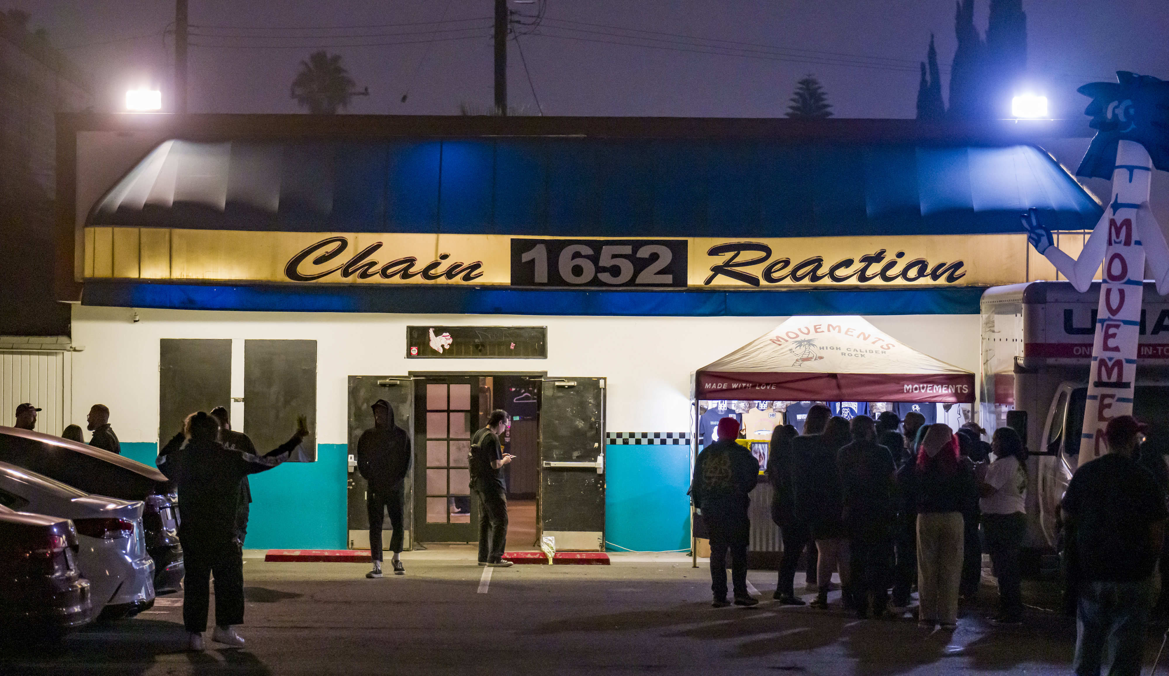Alt-music fans wait in lines outside the Chain Reaction venue...