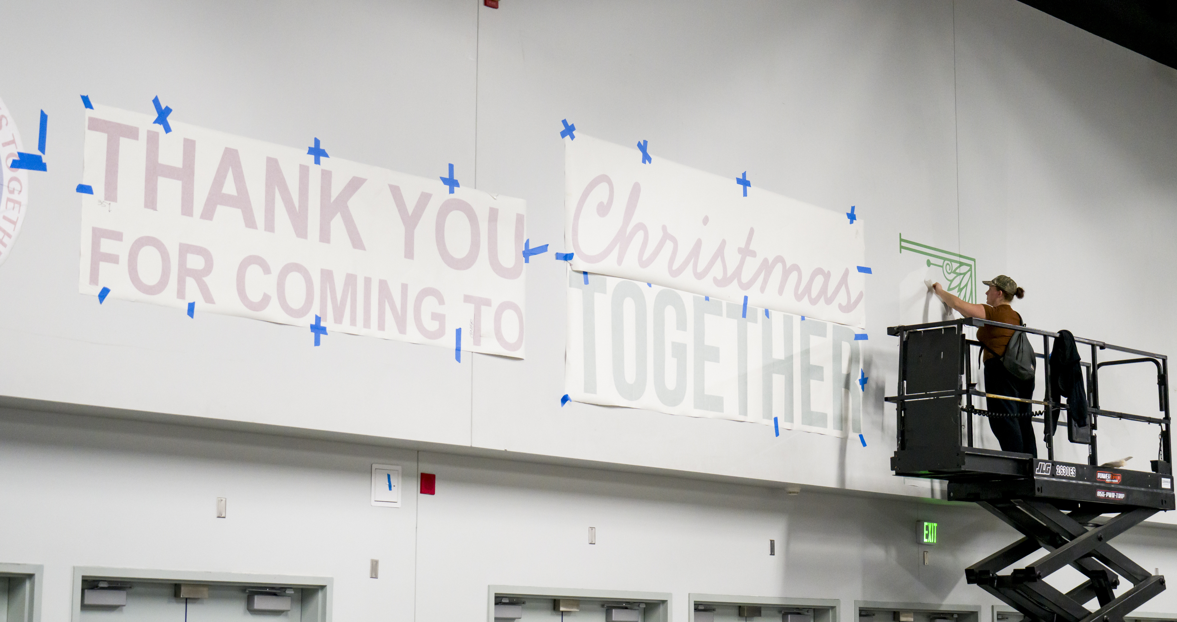 Kendra Caniggia of LA Print House puts up signage in...