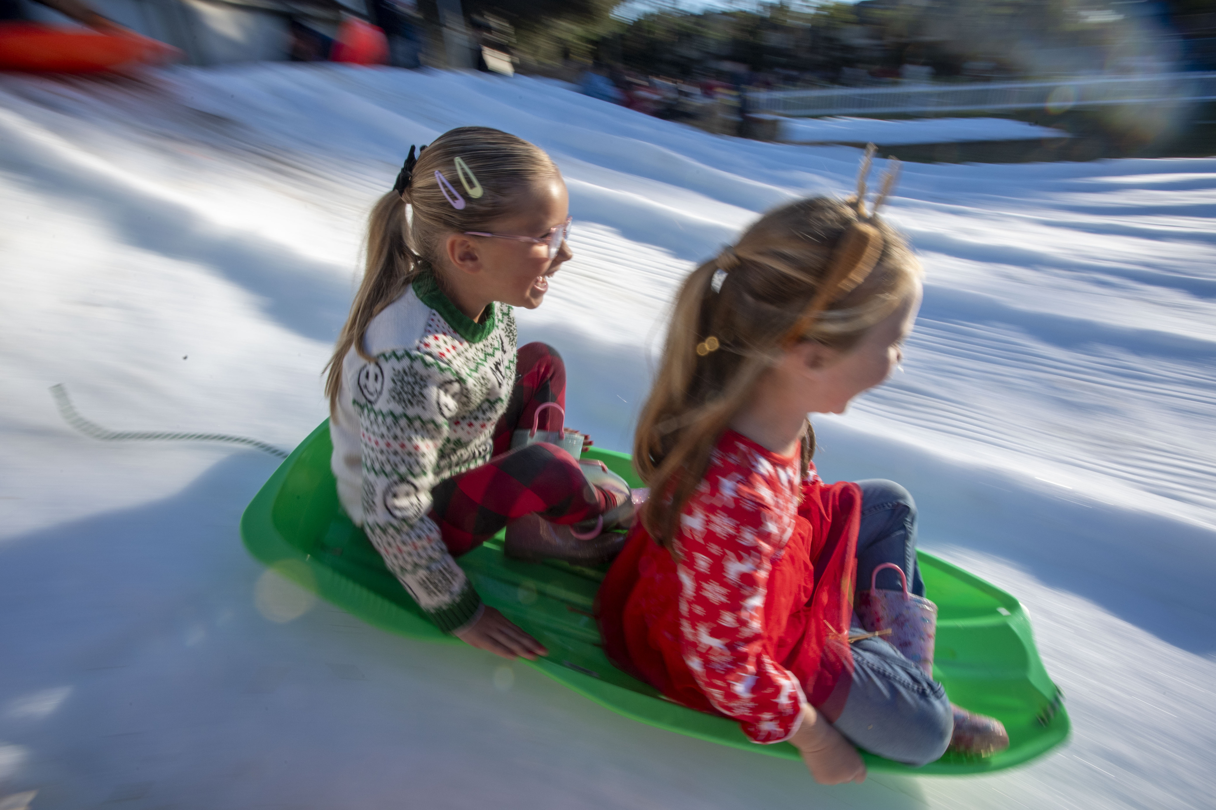 Emma Gallian and Brooklyn Hudson, both 5, share some sledding...