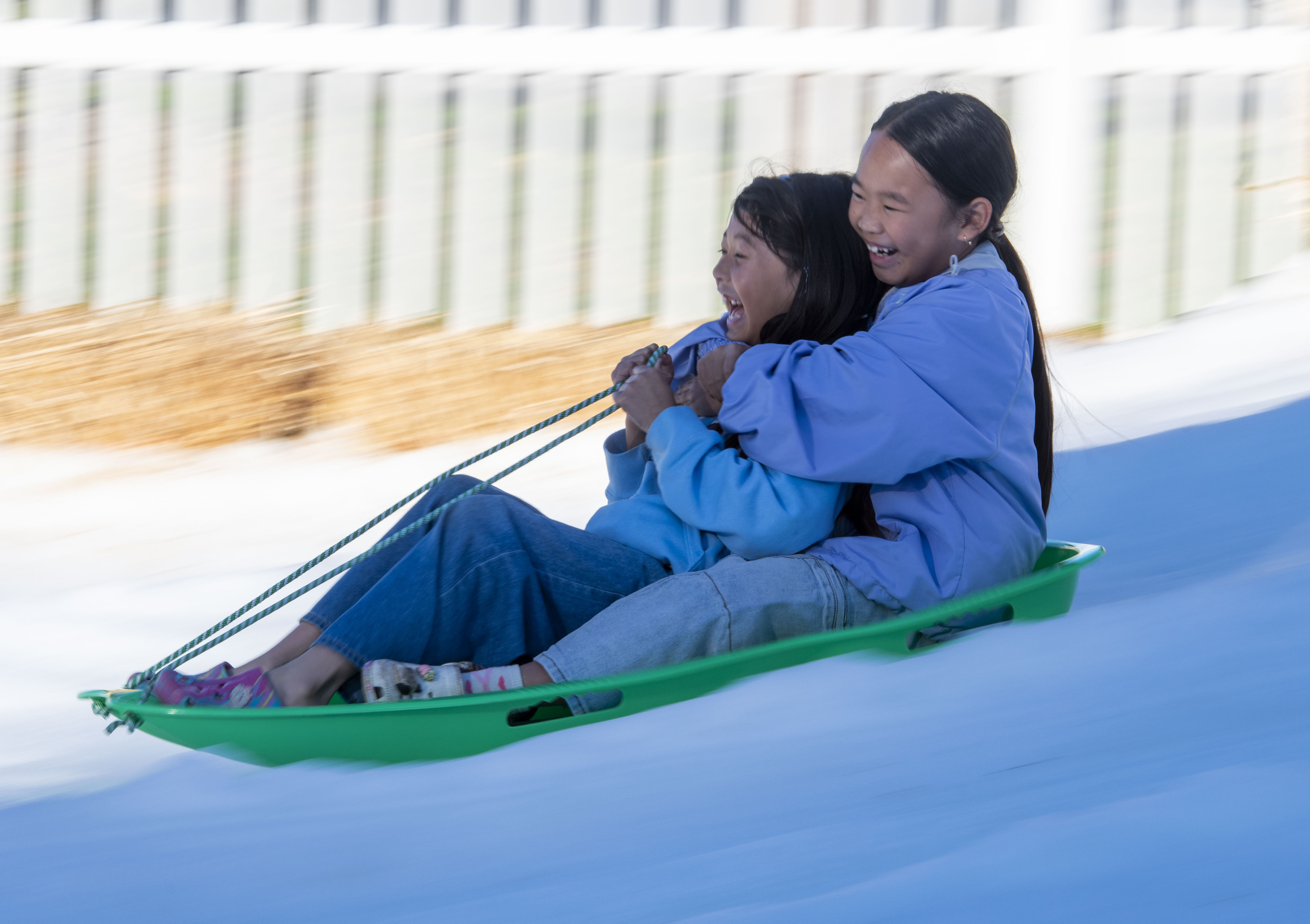 Friends Sophia Nguyen and Mea Nguyen, both 8, share a...