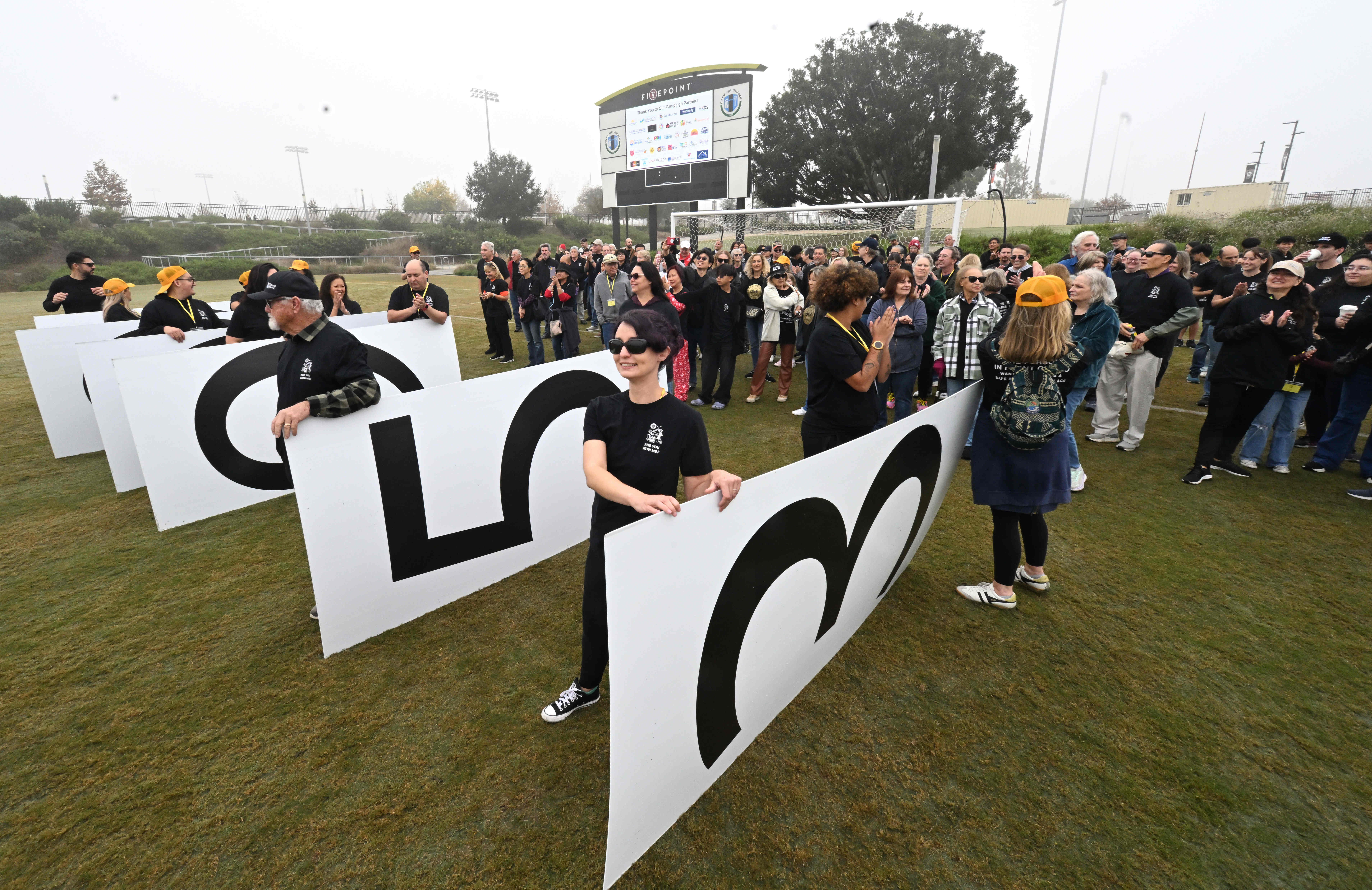 Giant numbers are readied representing the number of people going...