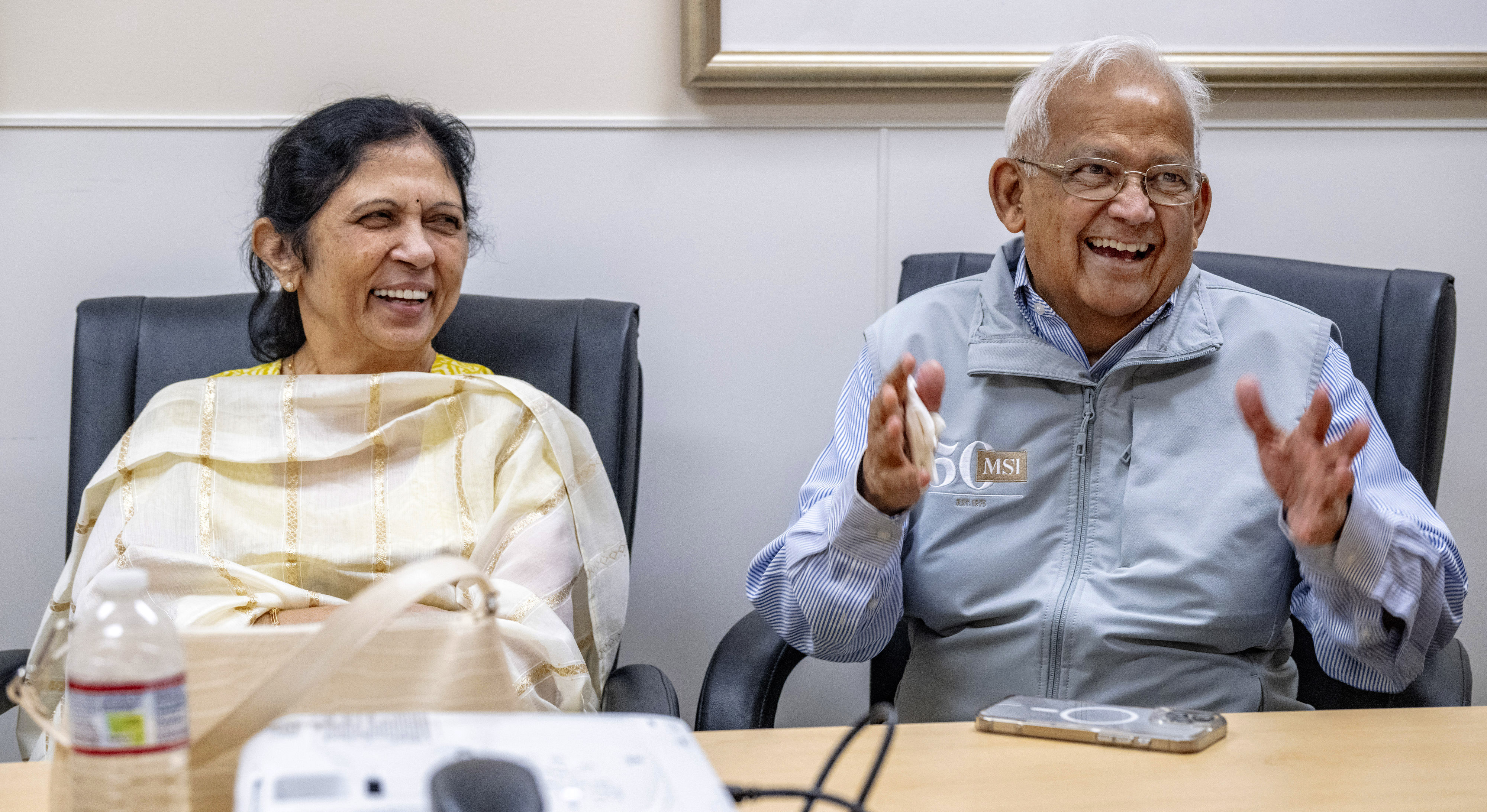 At right, Manu Shah, an Orange County business owner, and...