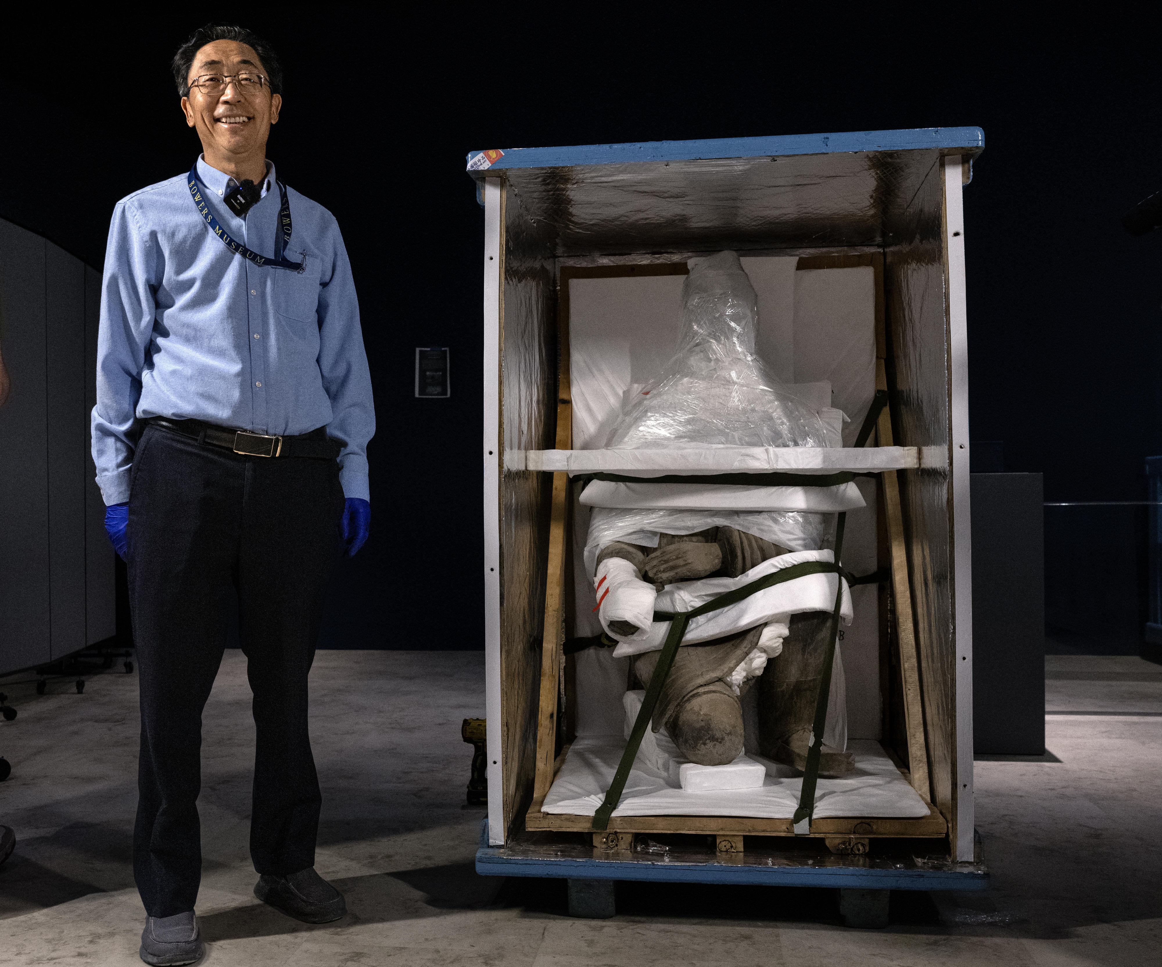 Bowers Museum chief curator Tianlong Jiao oversaw the visit by...