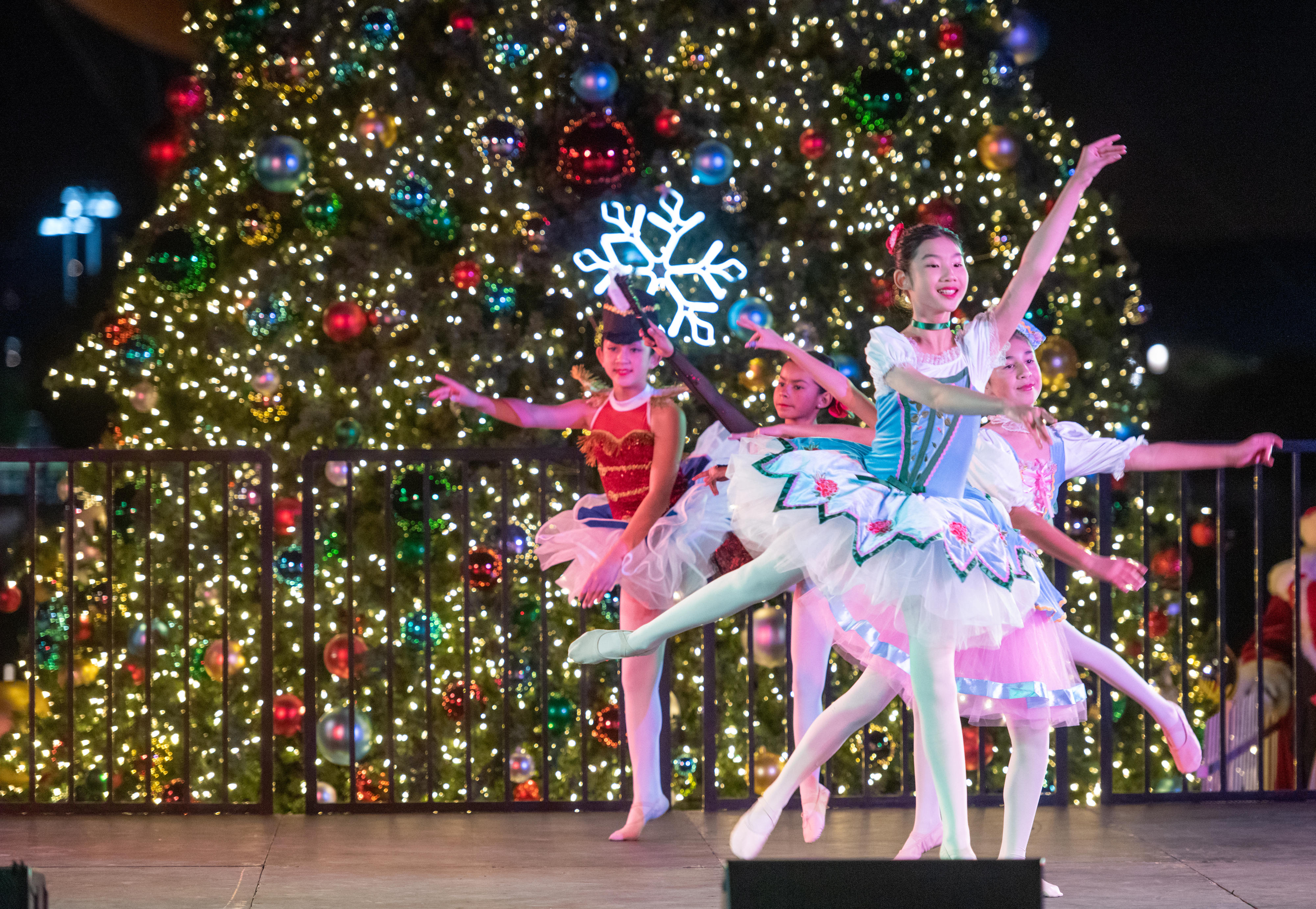 Members of the SOKA Arts Performers dance on stage in...