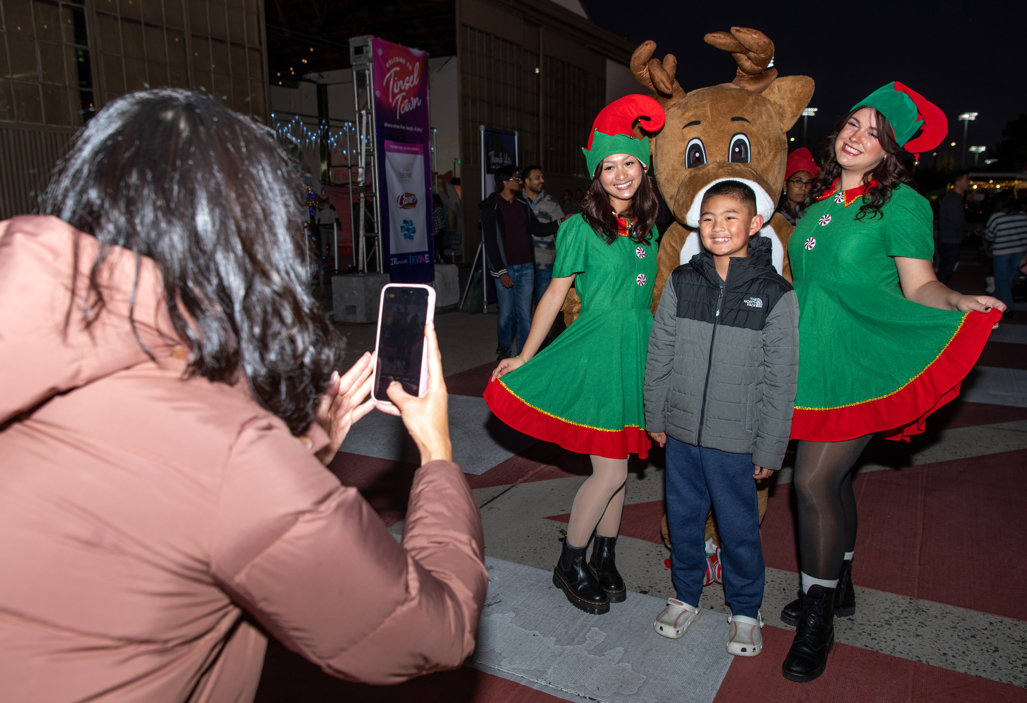 Jenny Chan of Tustin takes a photo of her son,...