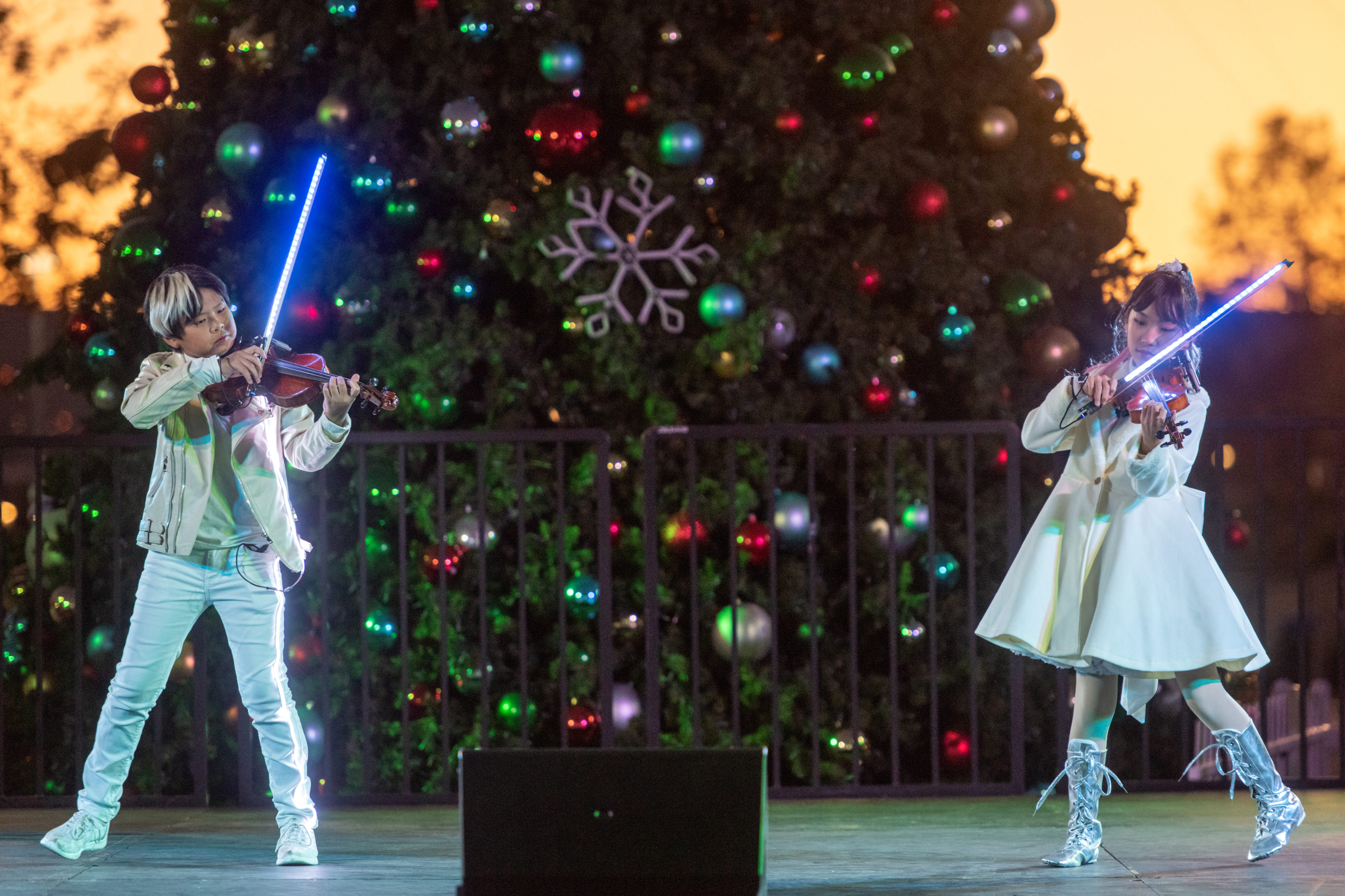 Viorhythm performs holiday classics on violins with lit-up bows on...