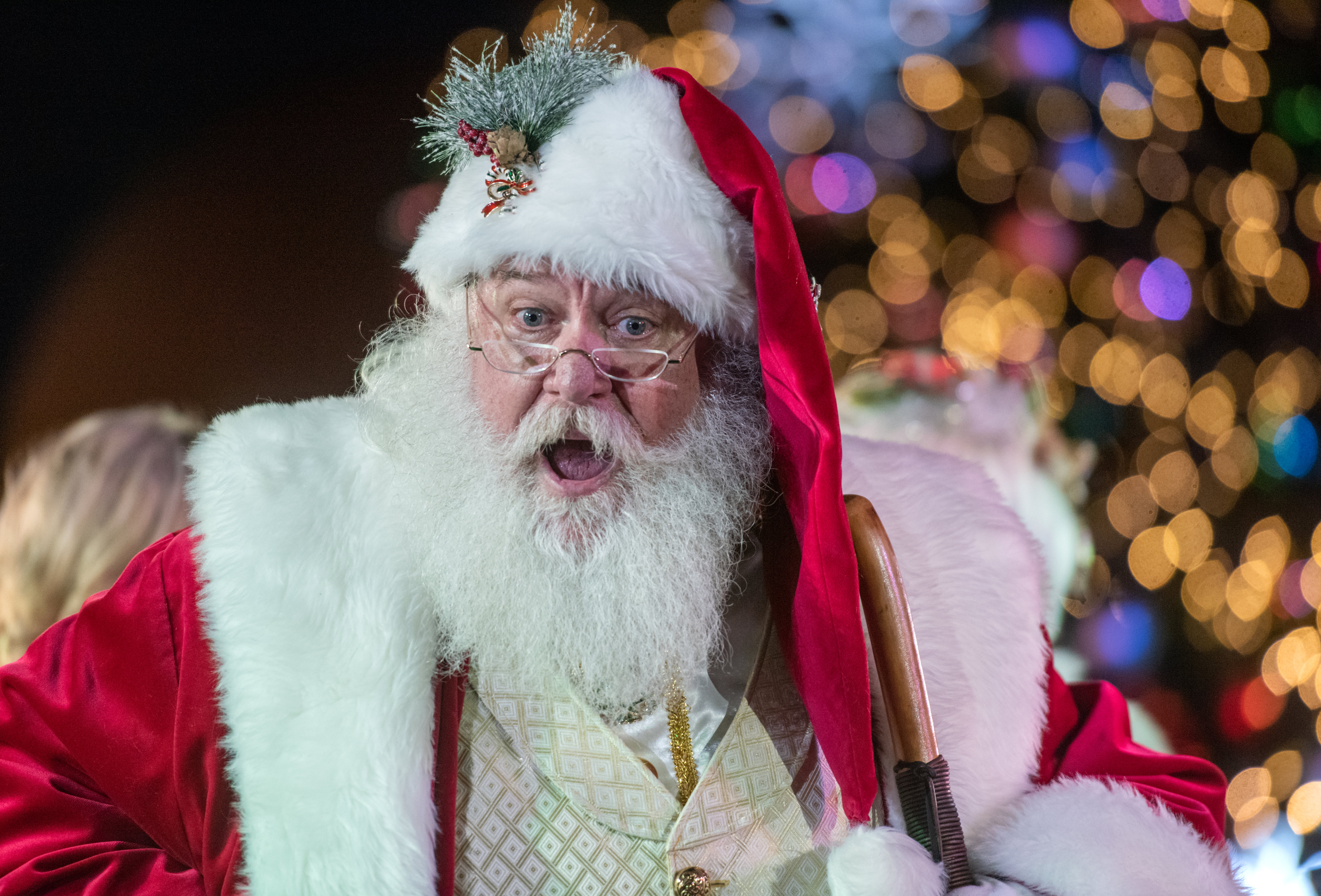 Santa greets a group of kids as he arrives on...