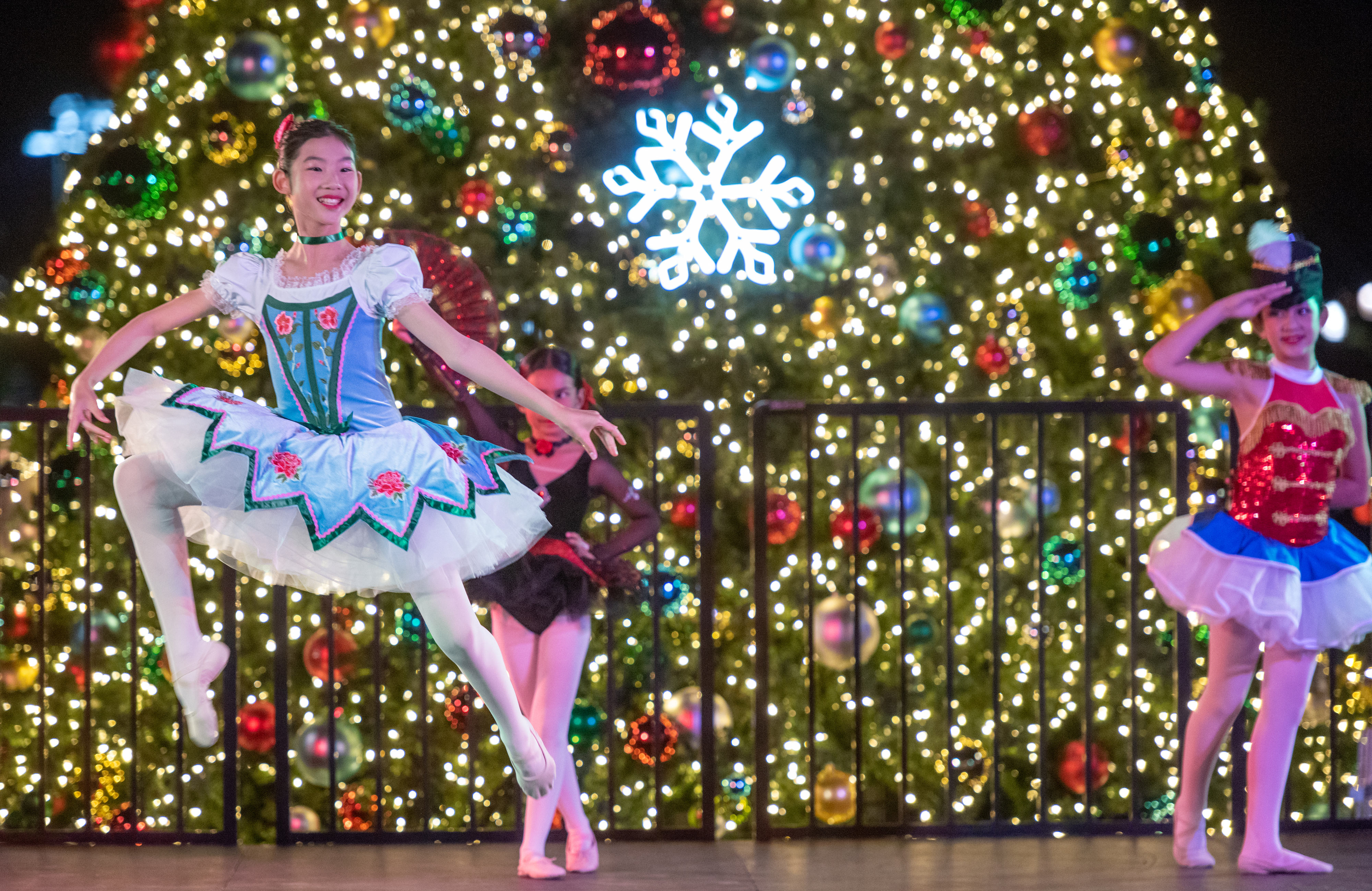 Members of the SOKA Arts Performers dance on stage in...