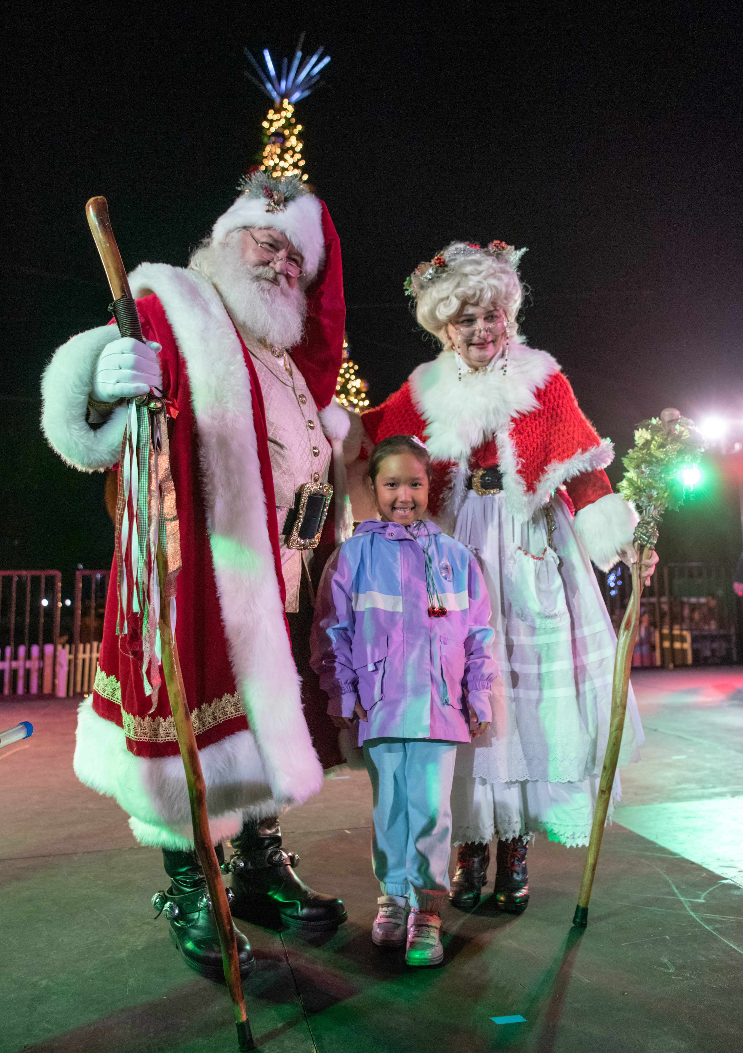 Hanshaiym Radj, 5, of Irvine stands with Santa and Mrs....