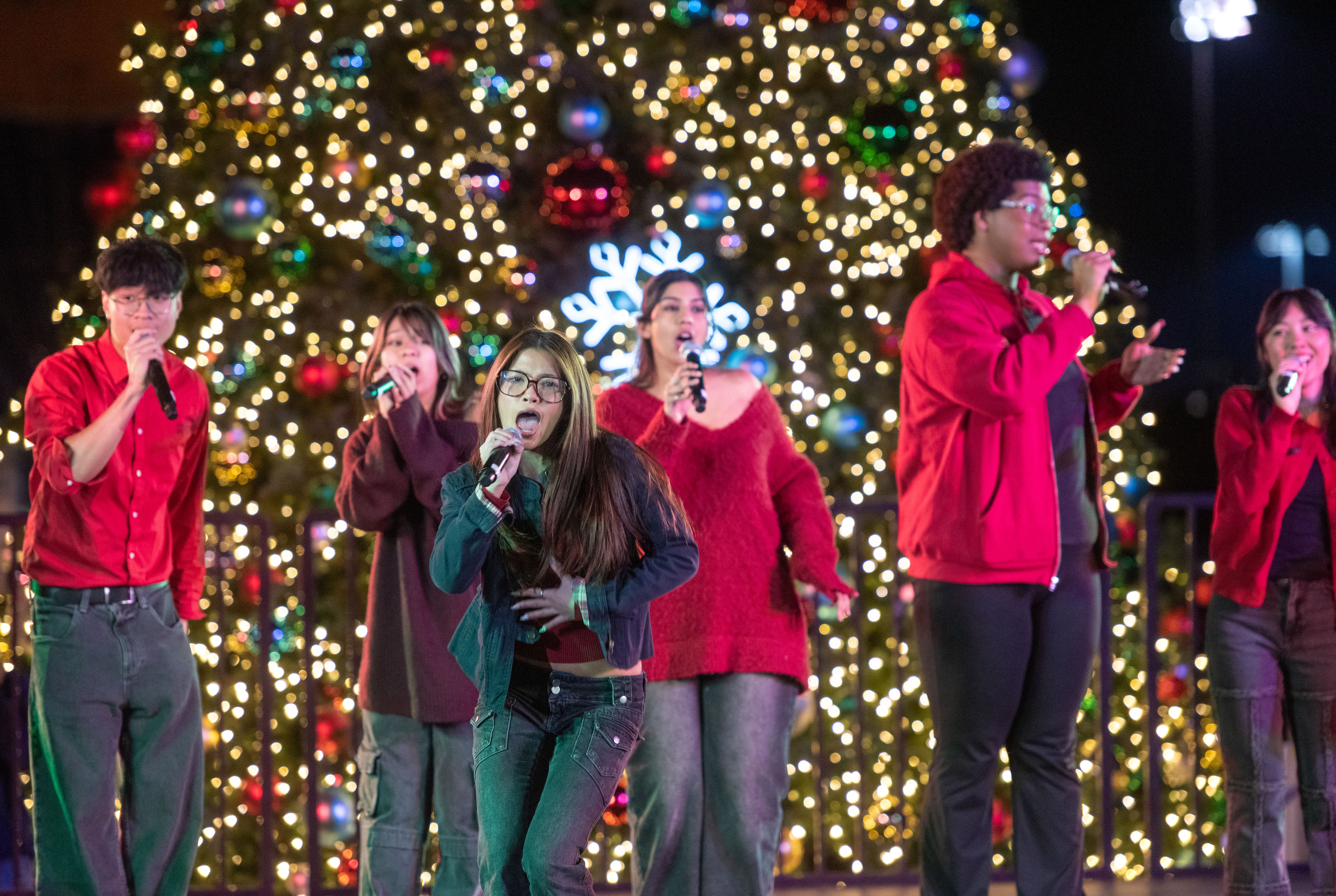 Members the Vermillion Vocalists, from UC Irvine, sing acapella holiday...