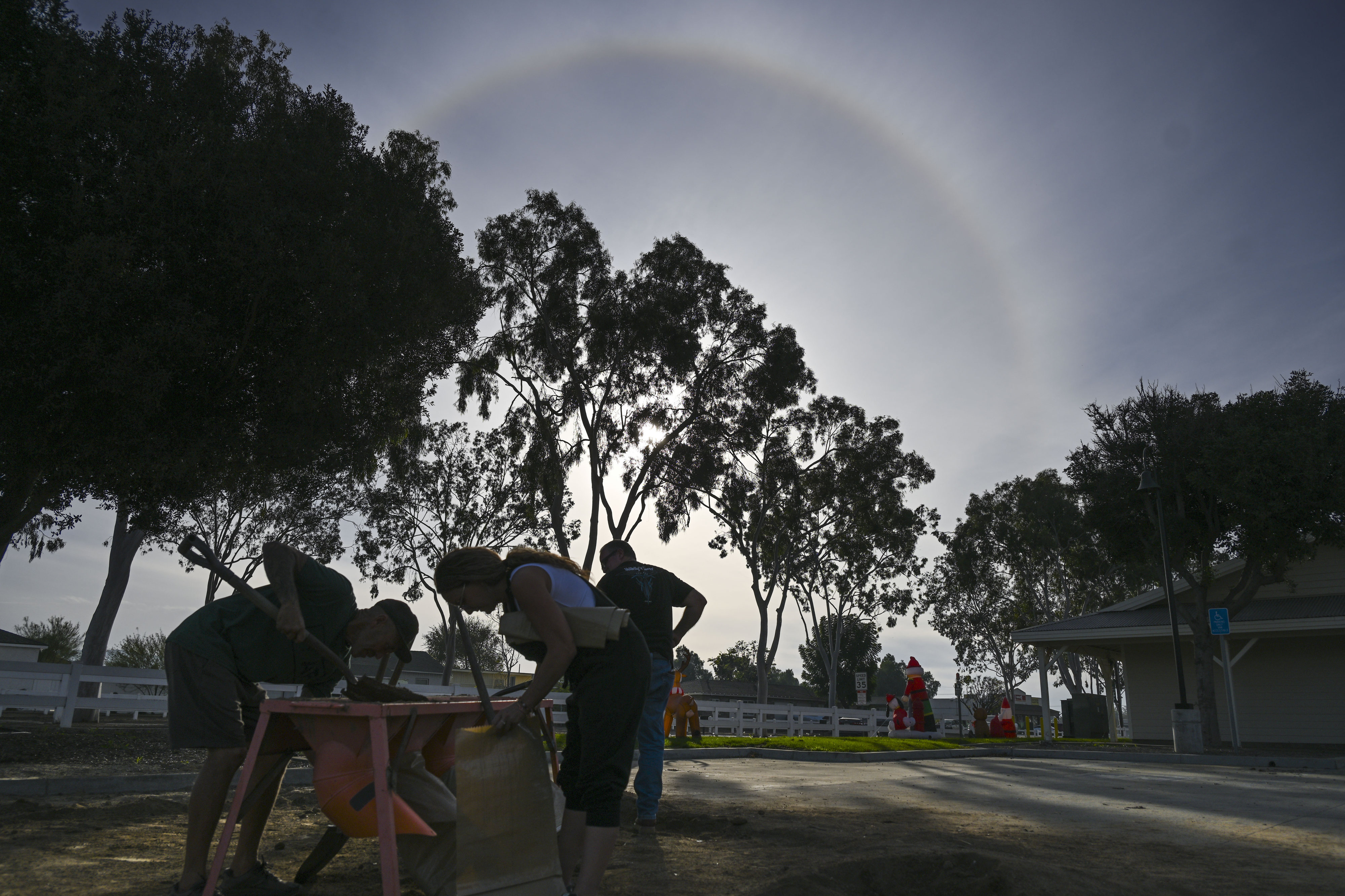 Norco residents fills sandbags at a Riverside County fire station...