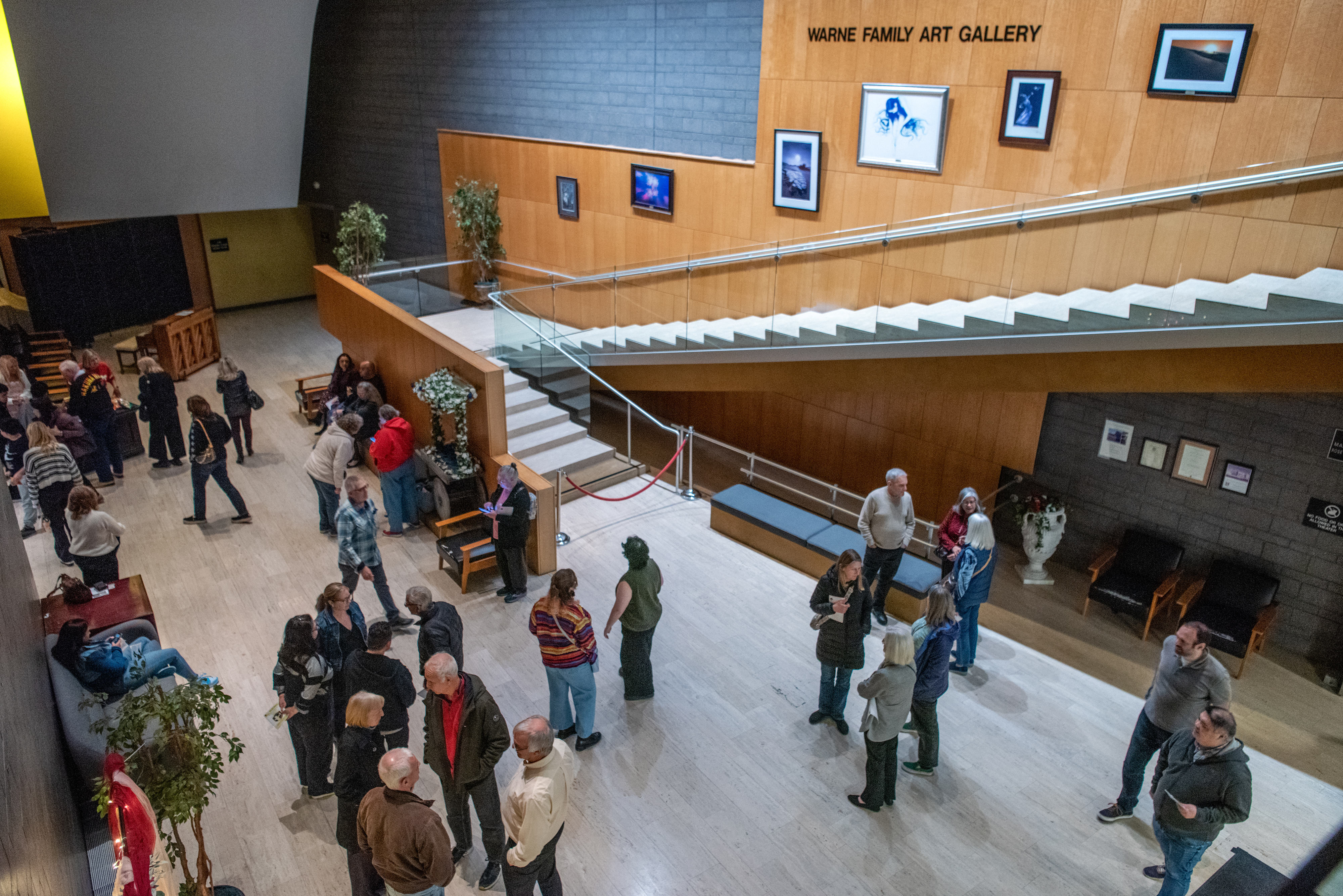 Patrons hang out in the lobby outside the Rose Center...