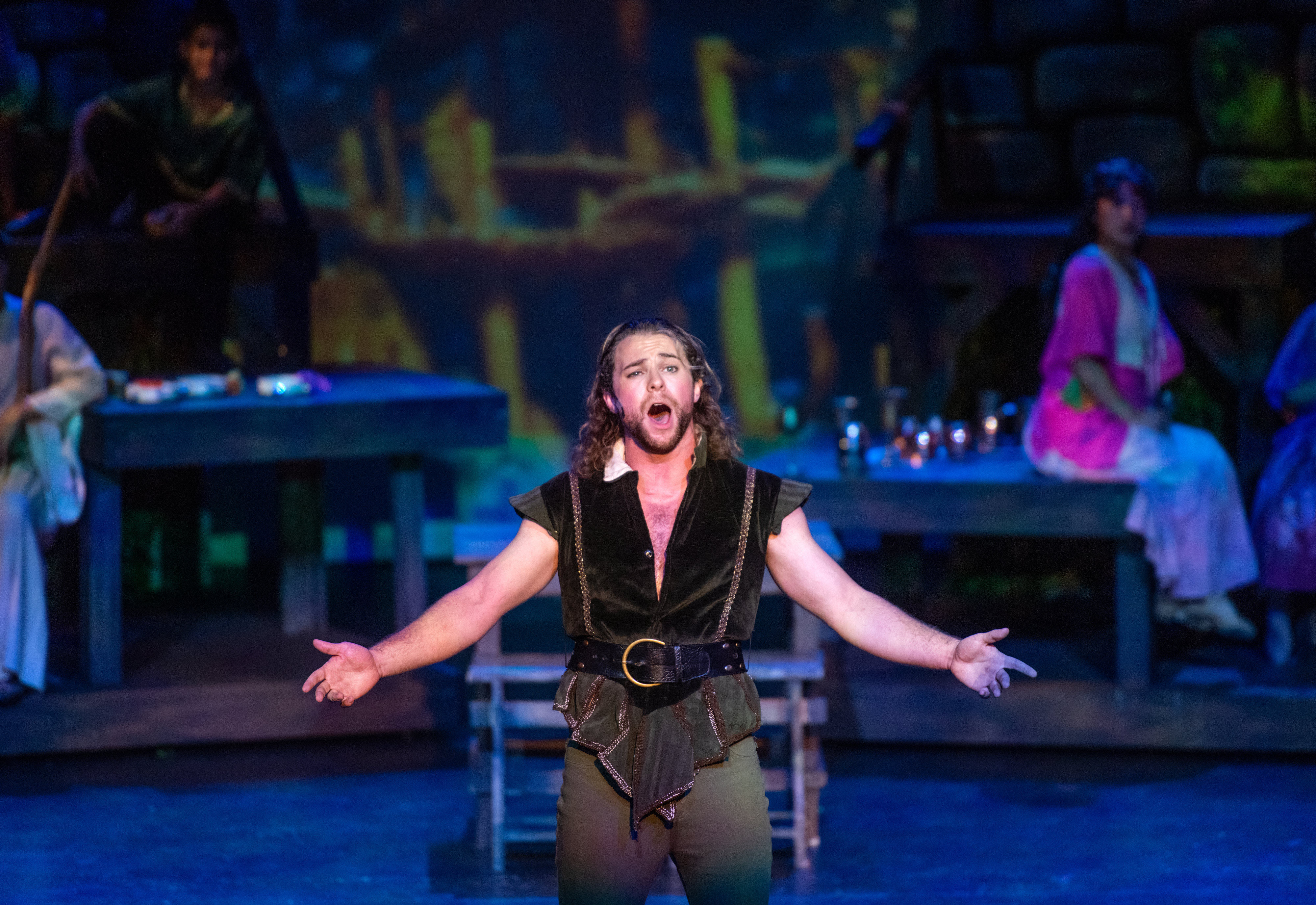 Brennan Eckberg, who plays Robin, sings on stage during a...