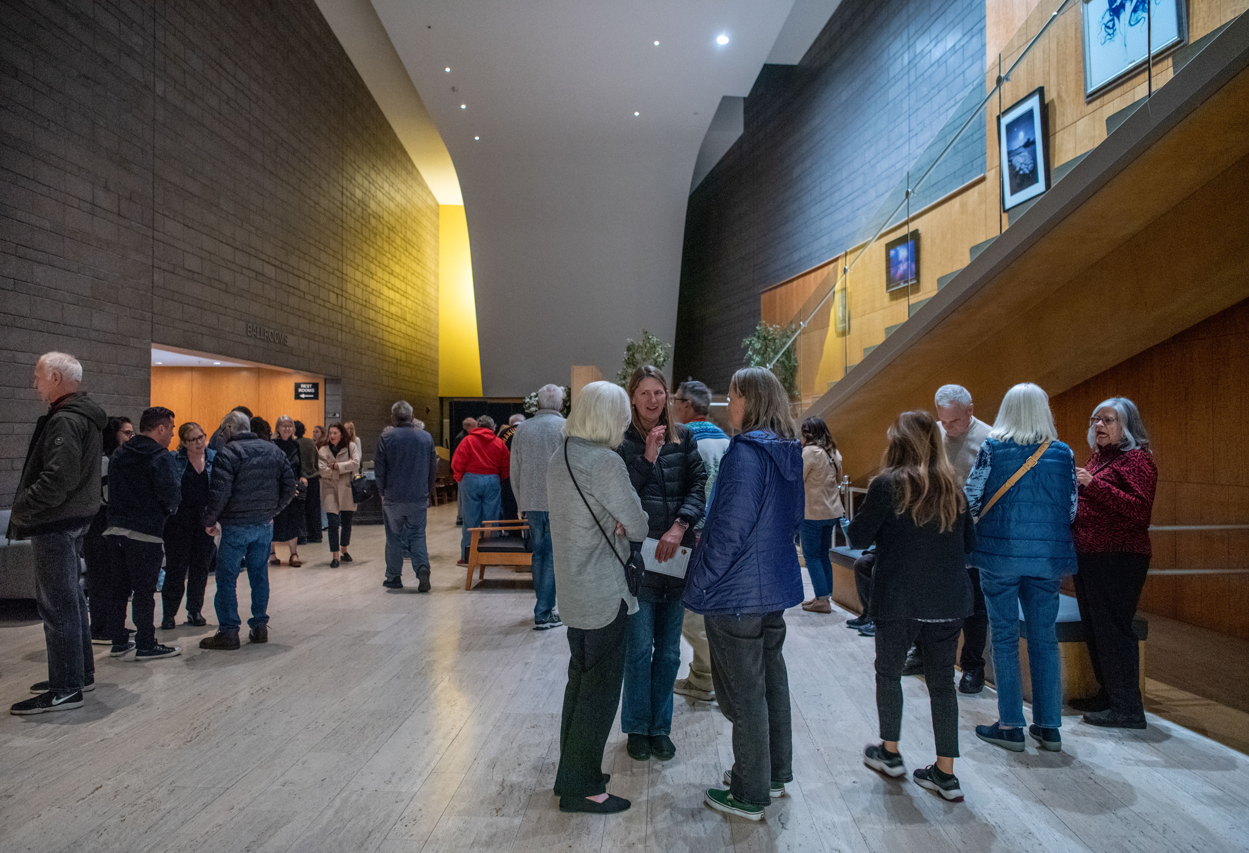 Patrons hang out in the lobby outside the Rose Center...