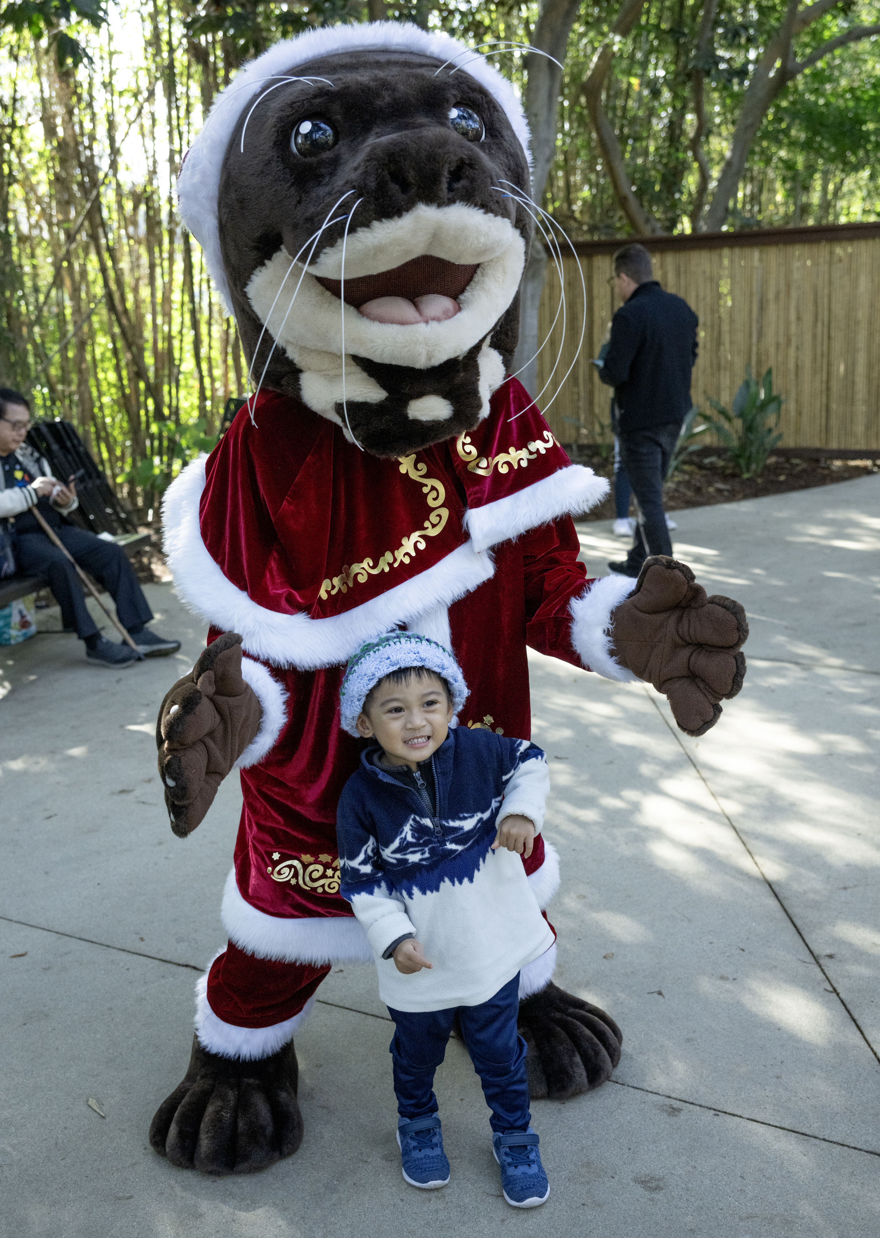Liam Ly, 2, meets a giant otter during Santa Ana...