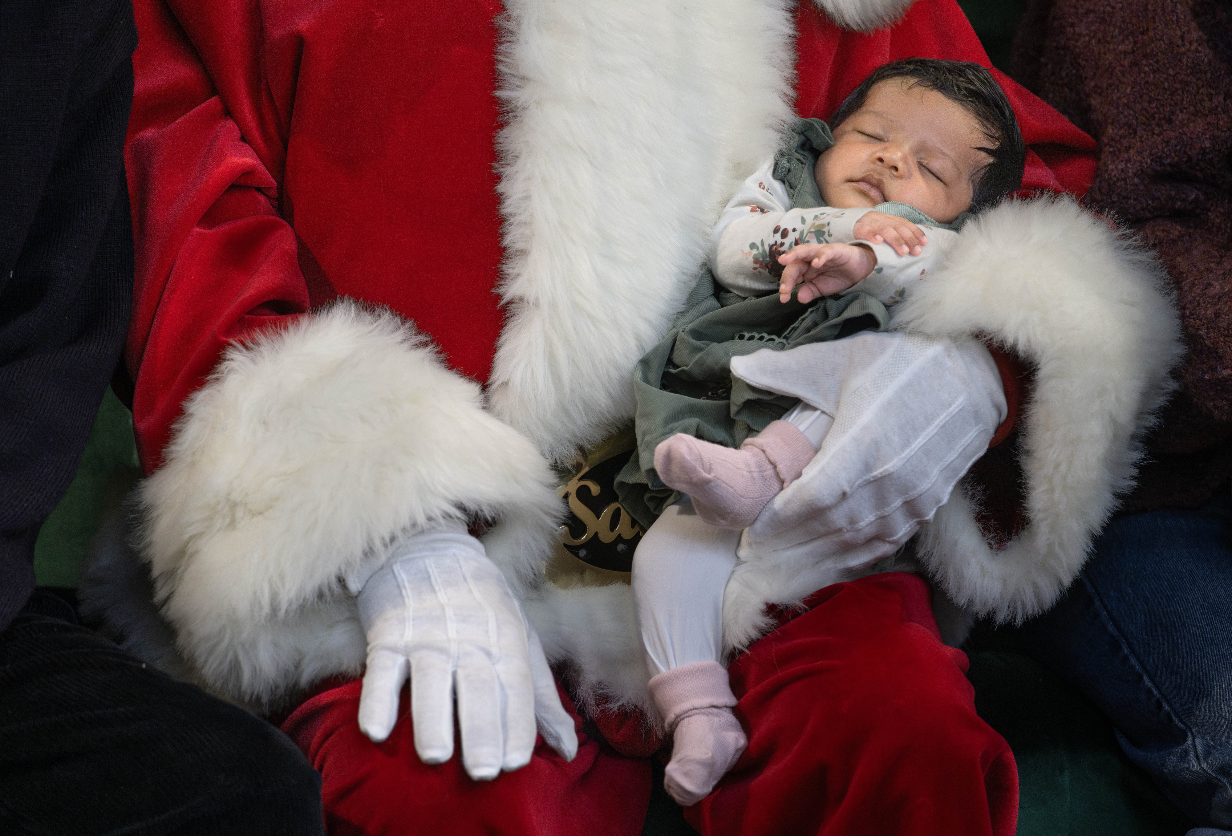 Looking angelic in Santa’s arms, 6-week-old Lottie Leurentop gets her...