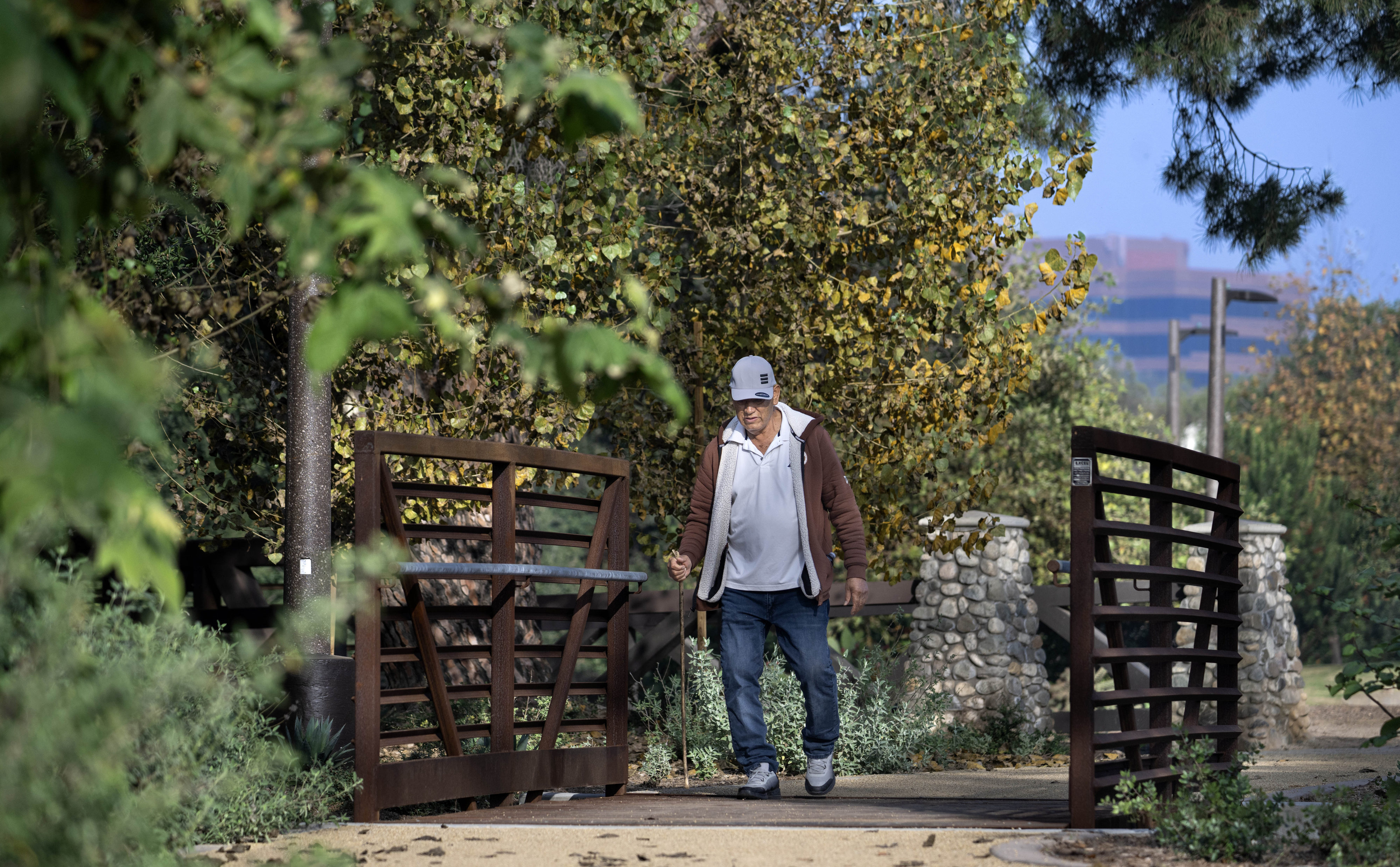 A wooden bridge at Santiago Park, with a view of...