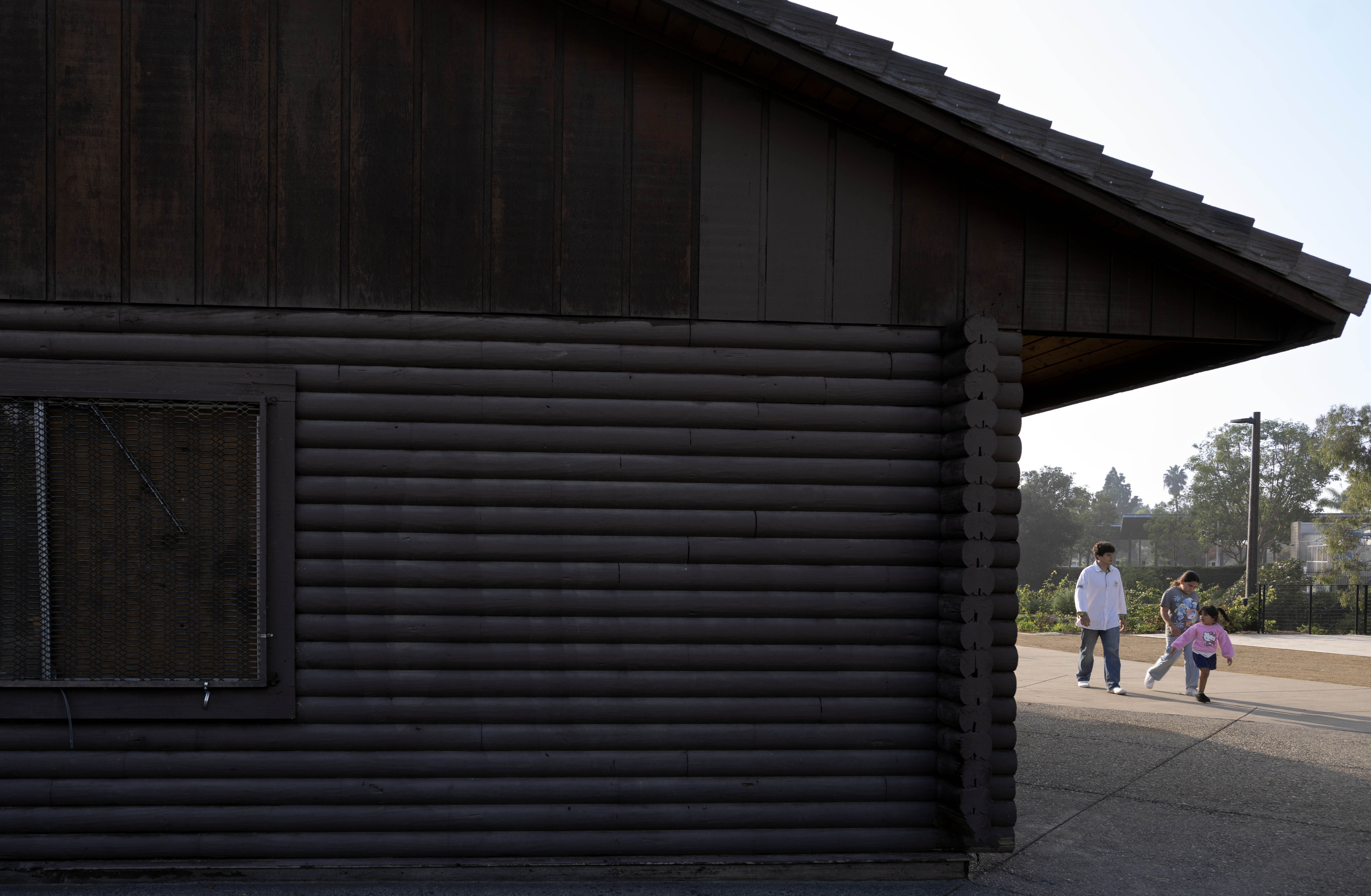 Ethan Doyer strolls with his nieces Aurora Lopez, 10, and...