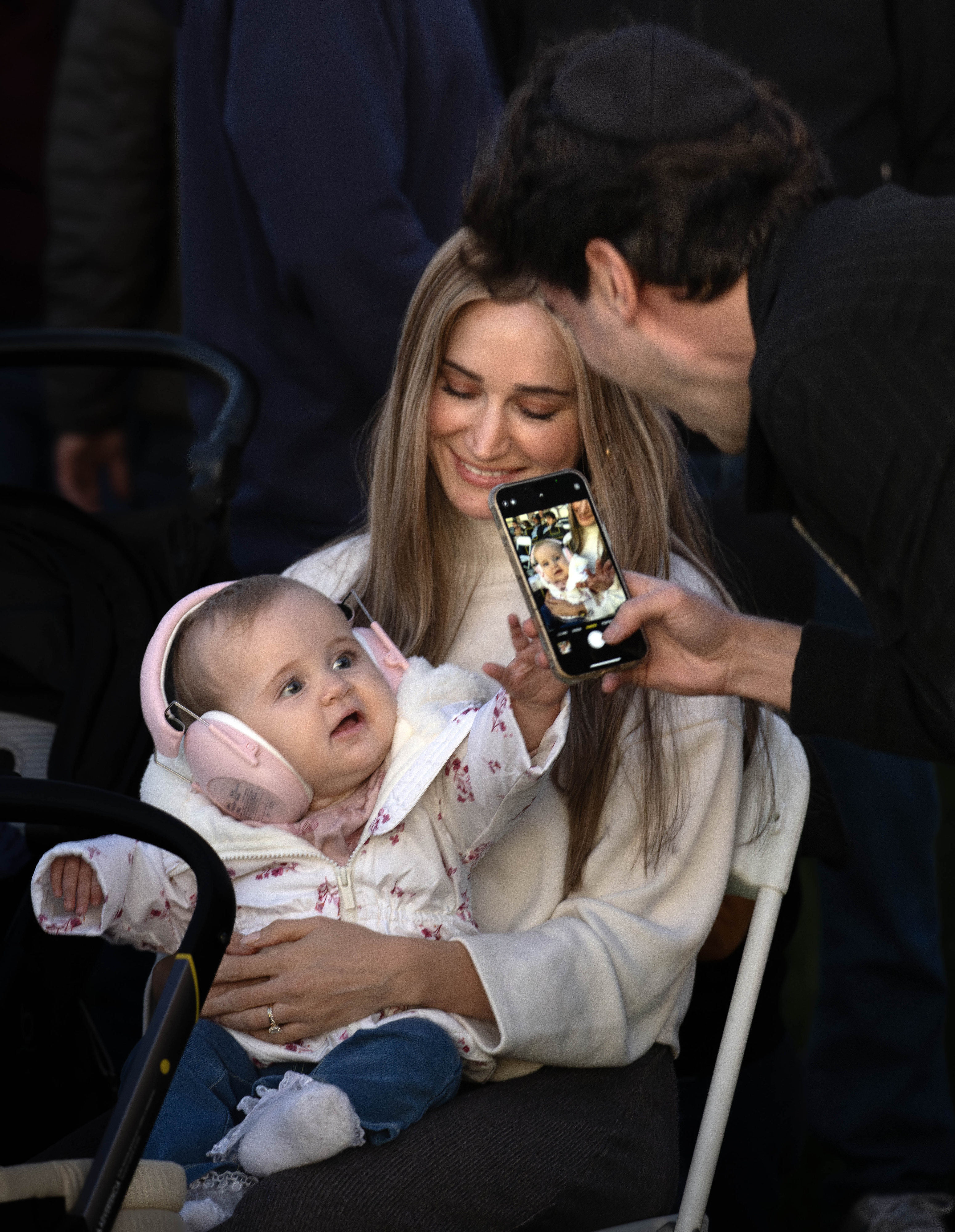 Isaac Gordon takes a picture of his wife Allison and...