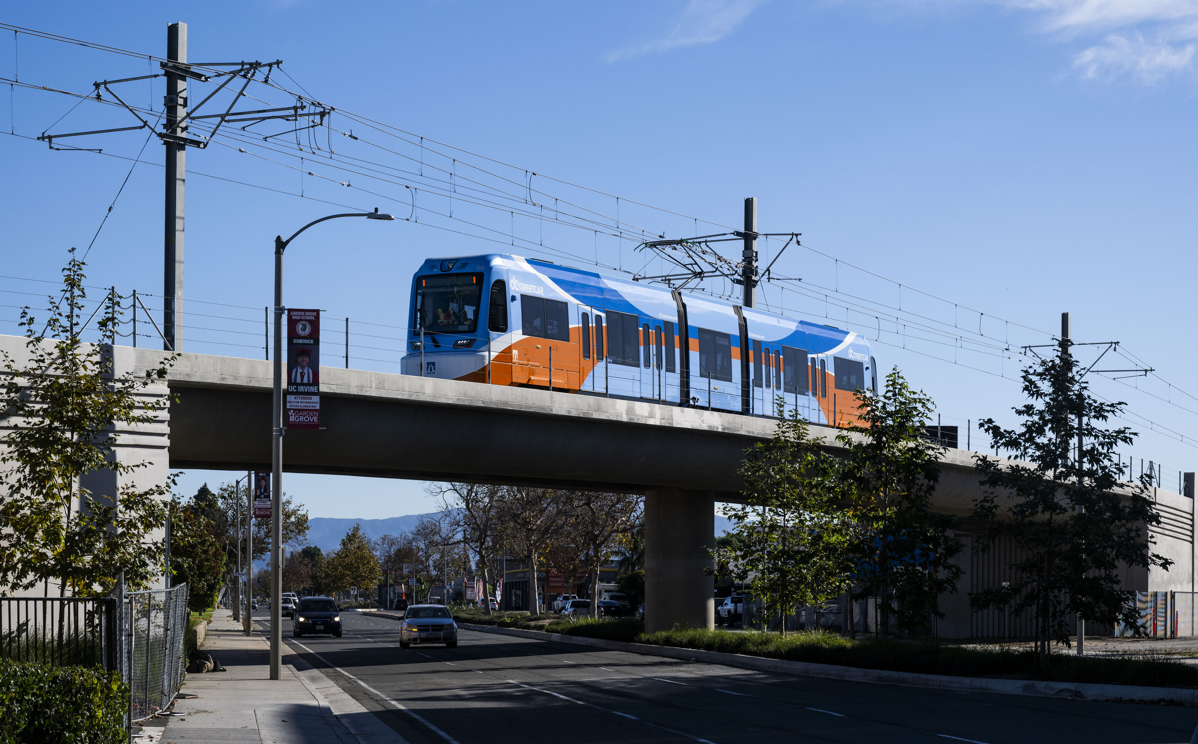 An OC Streetcar train crosses over Westminster Ave. from Santa...