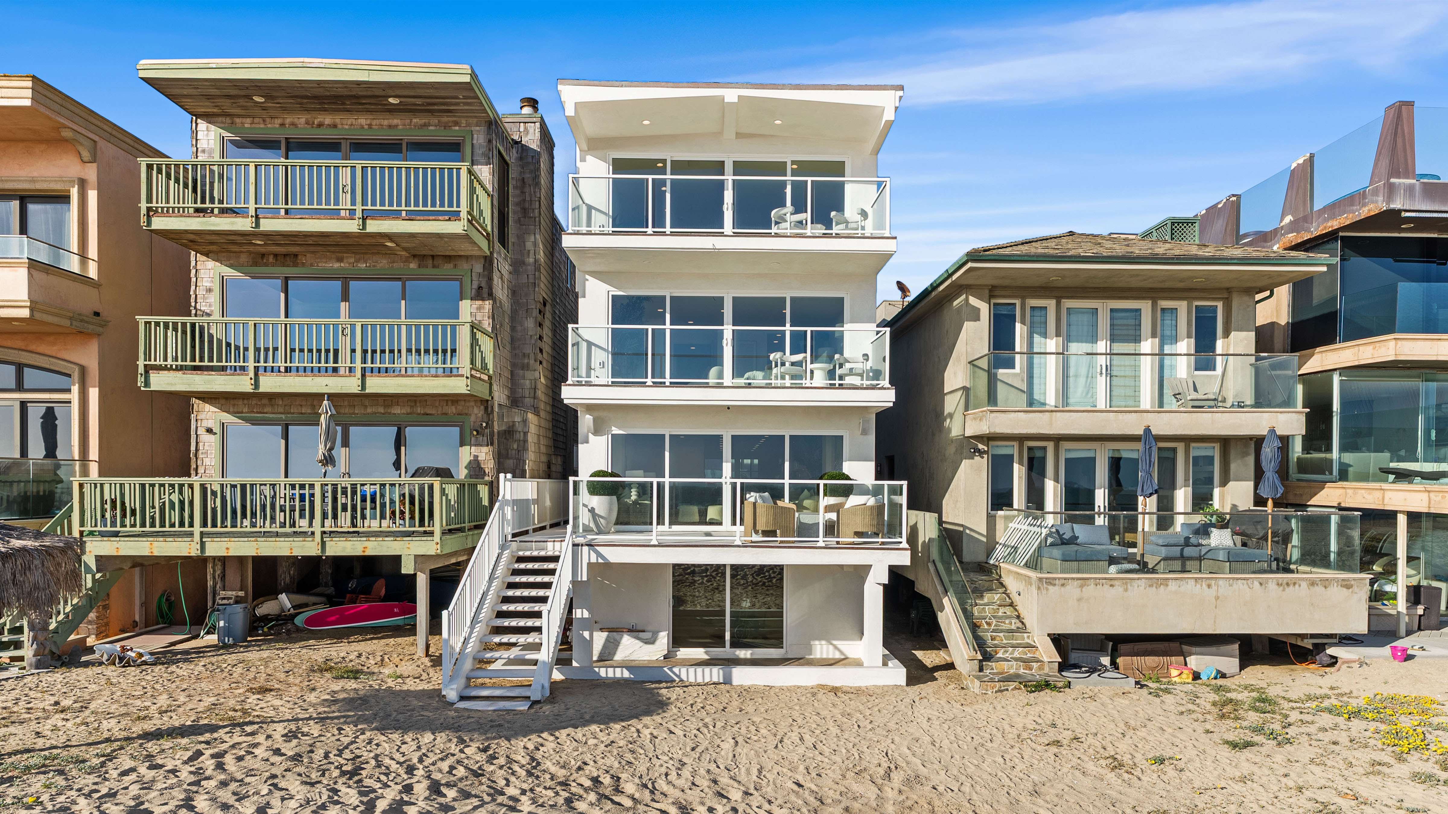 The Seal Beach home, center, recently sold off-market for over...
