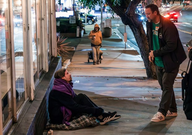 A man is questioned during the Orange County Point in Time Count in Jan., 2024. The federally mandated biennial census of homeless people, showed an increase in Orange County's homeless population -28% - from the 2022 survey. The majority lived on the streets...(Photo by Leonard Ortiz, Orange County Register/SCNG)