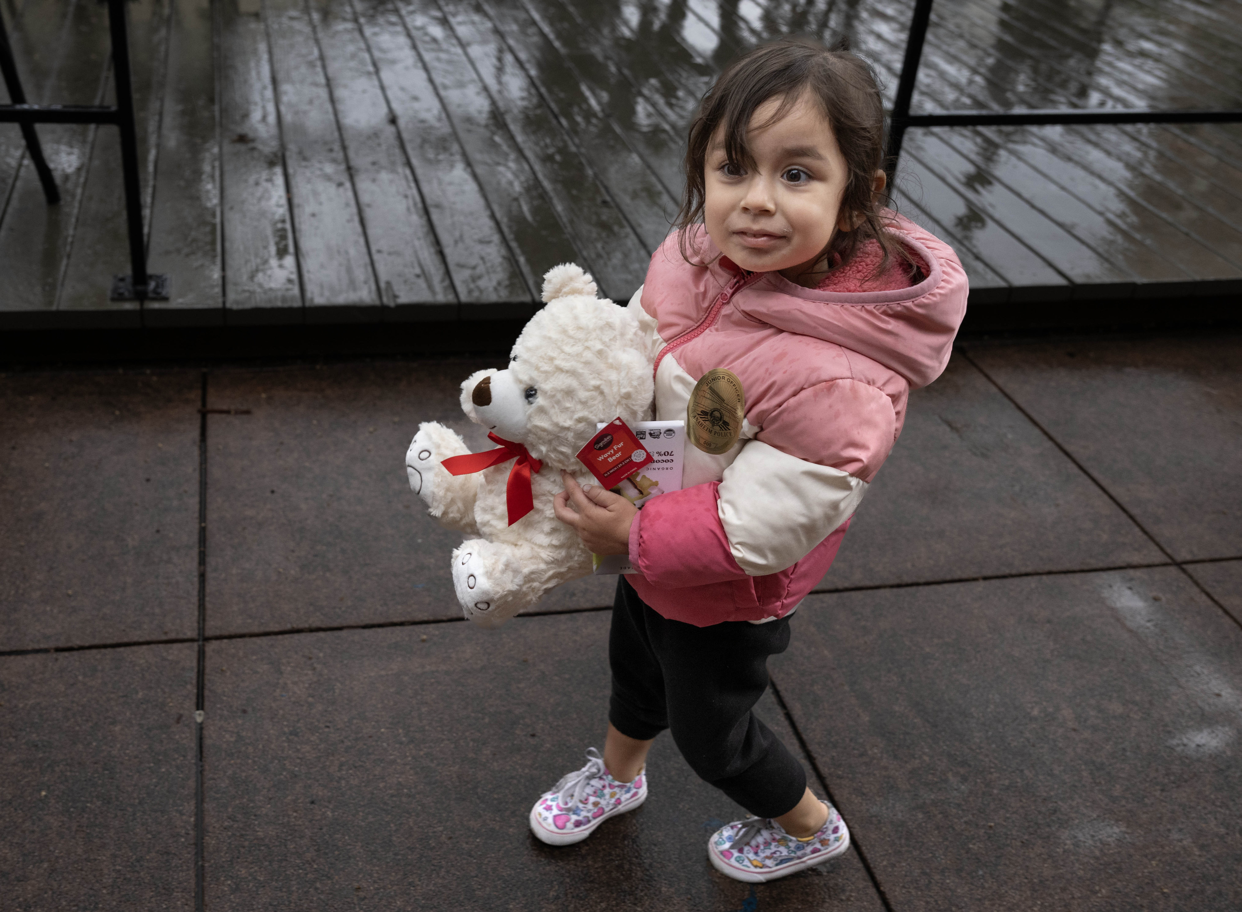 Camila Ulloa, 3,gets a new teddy bear during Anaheim’s annual...