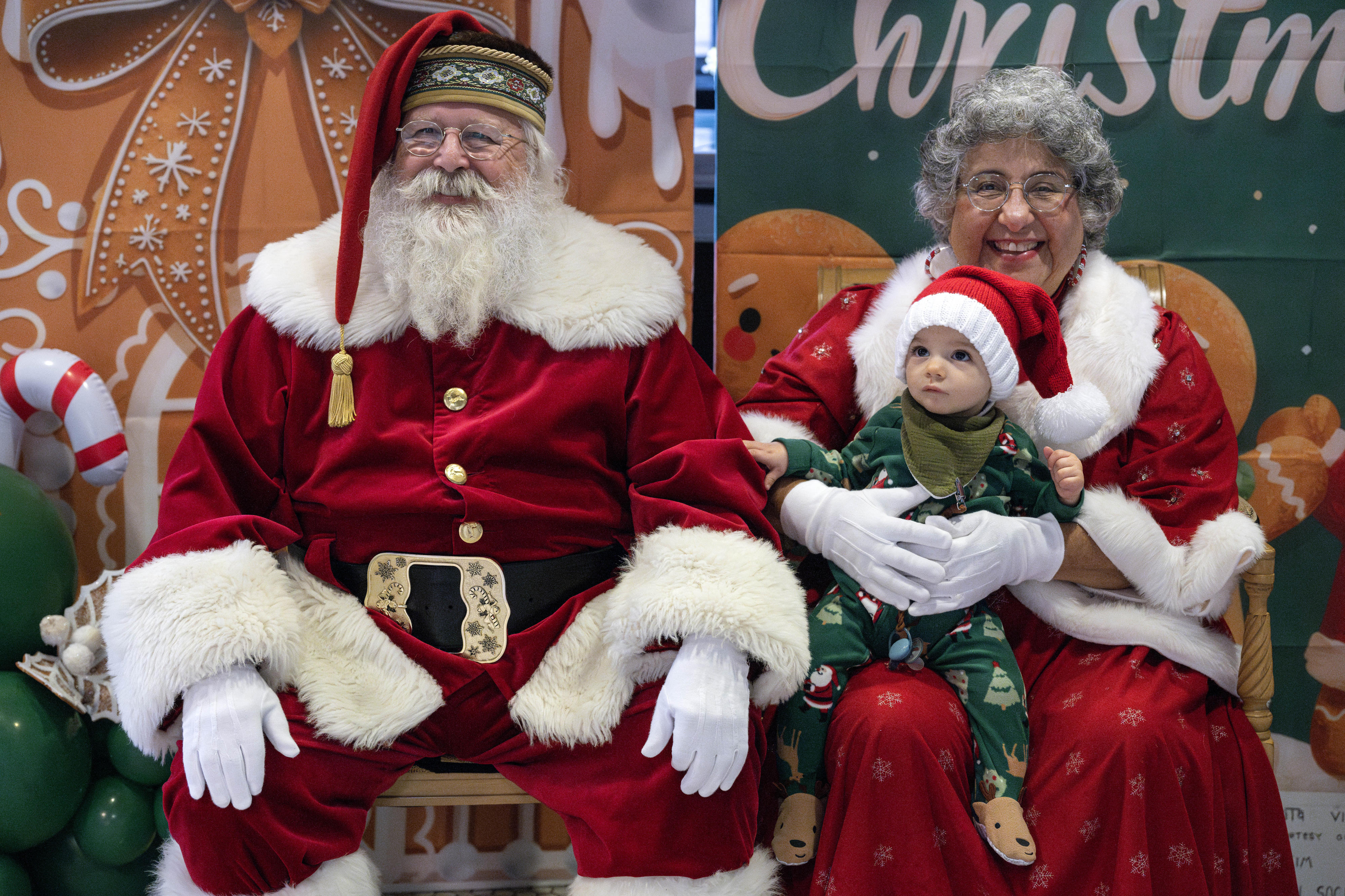 Nine-month-old Wesley Griffin meets Mr. and Mrs. Claus during Anaheim’s...