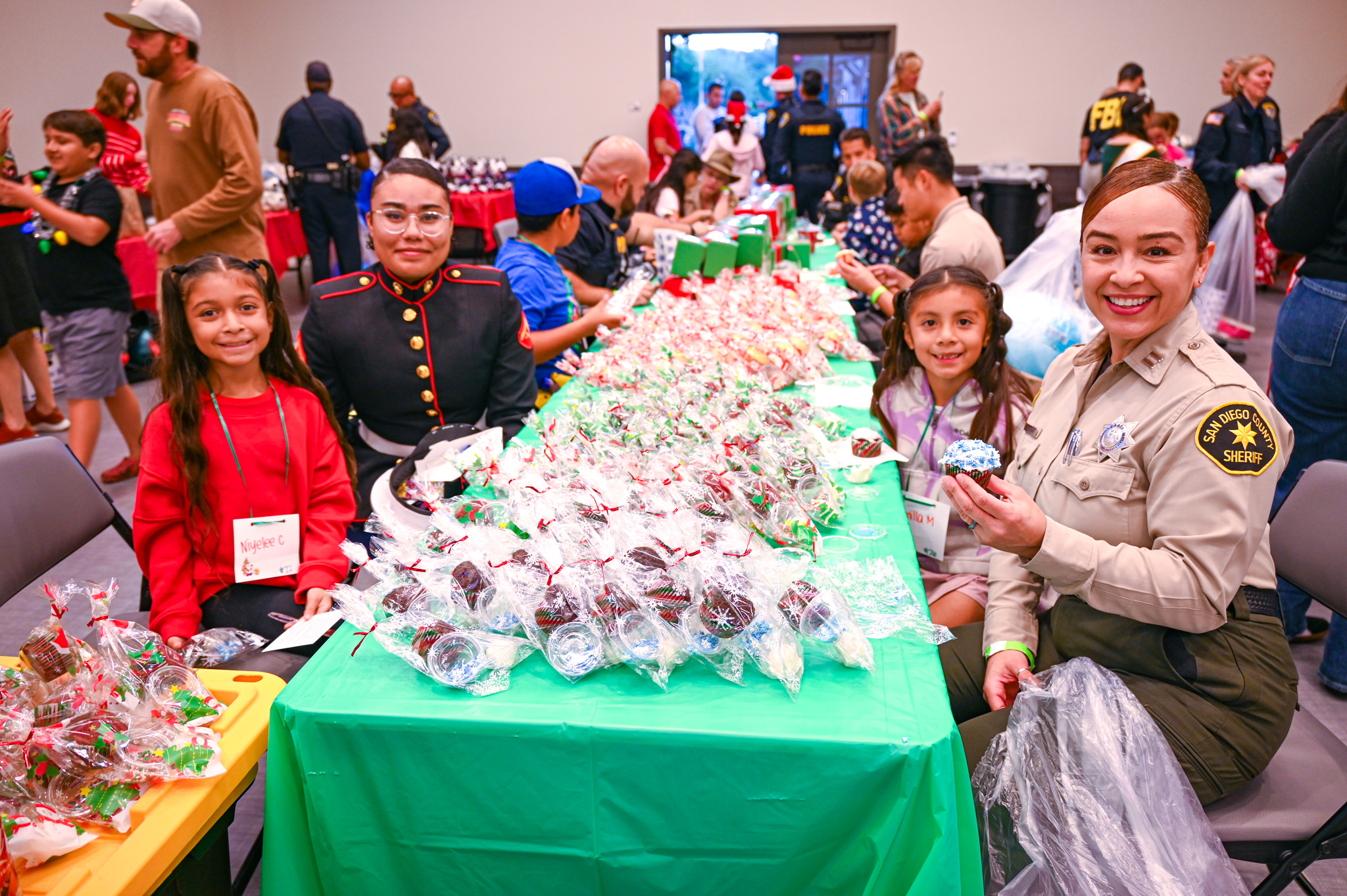 From left, Nyelee Chavez decorated cupcakes with her hero, Lcpl....