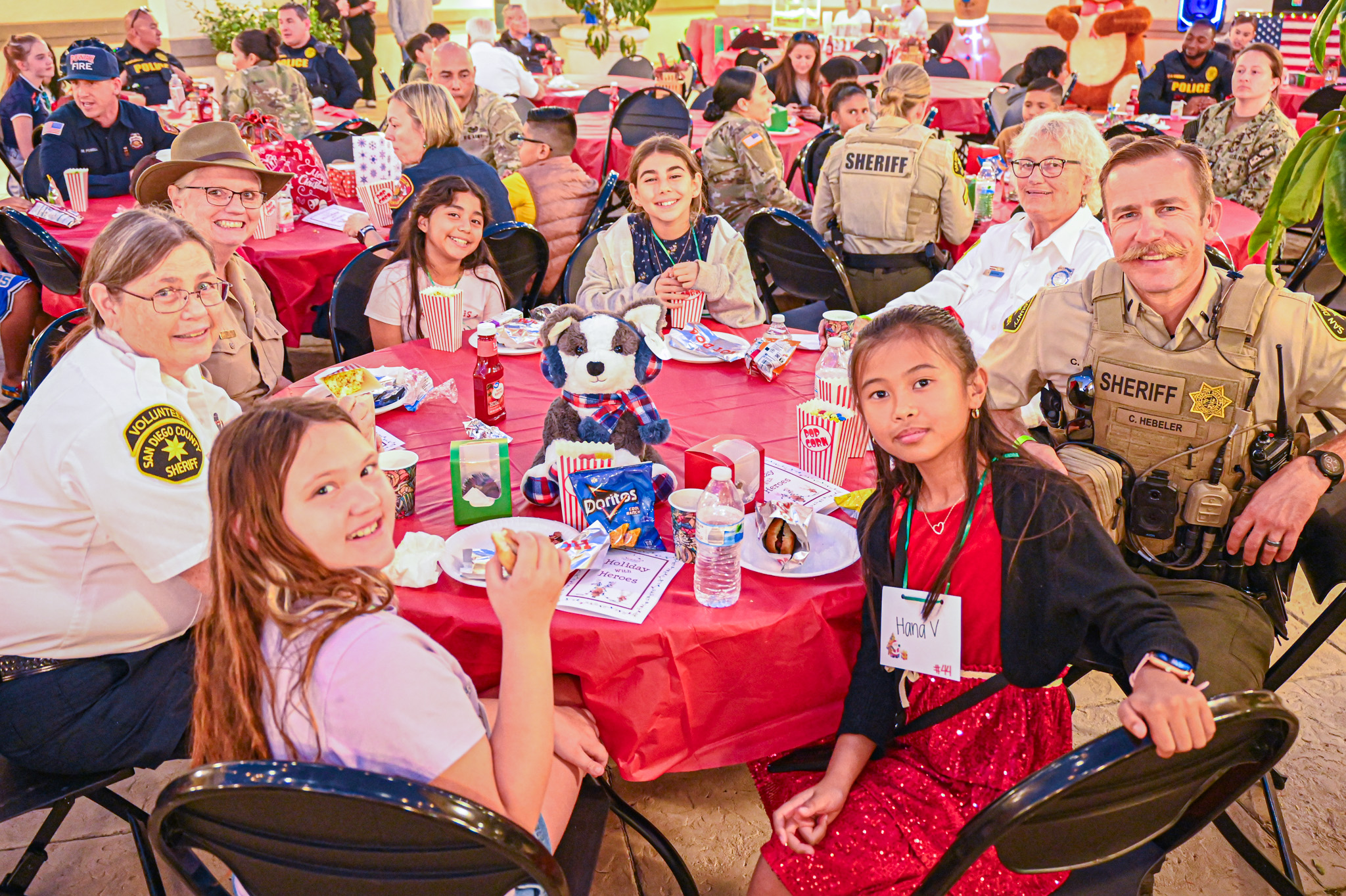 From left, Paisley Erickson with her hero, Volunteer Sheriff Patrol...