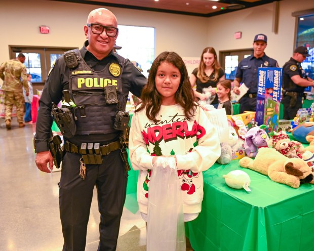 San Diego police Officer Ko Luangamath with Leilani Bocardo at the start of her shopping experience. (Criselda Yee)