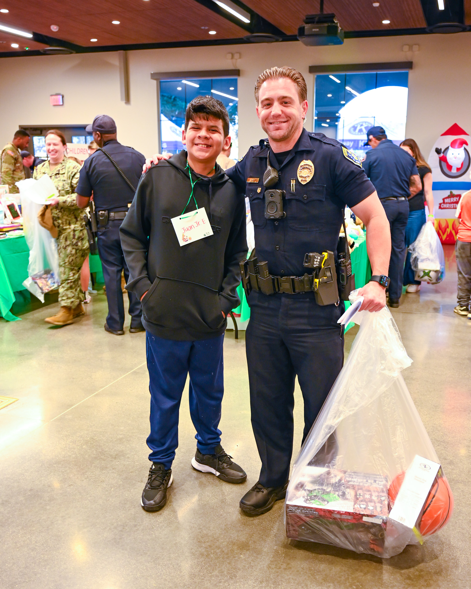 San Diego police Officer Cody Wolf with Juan Eiligio Jr....