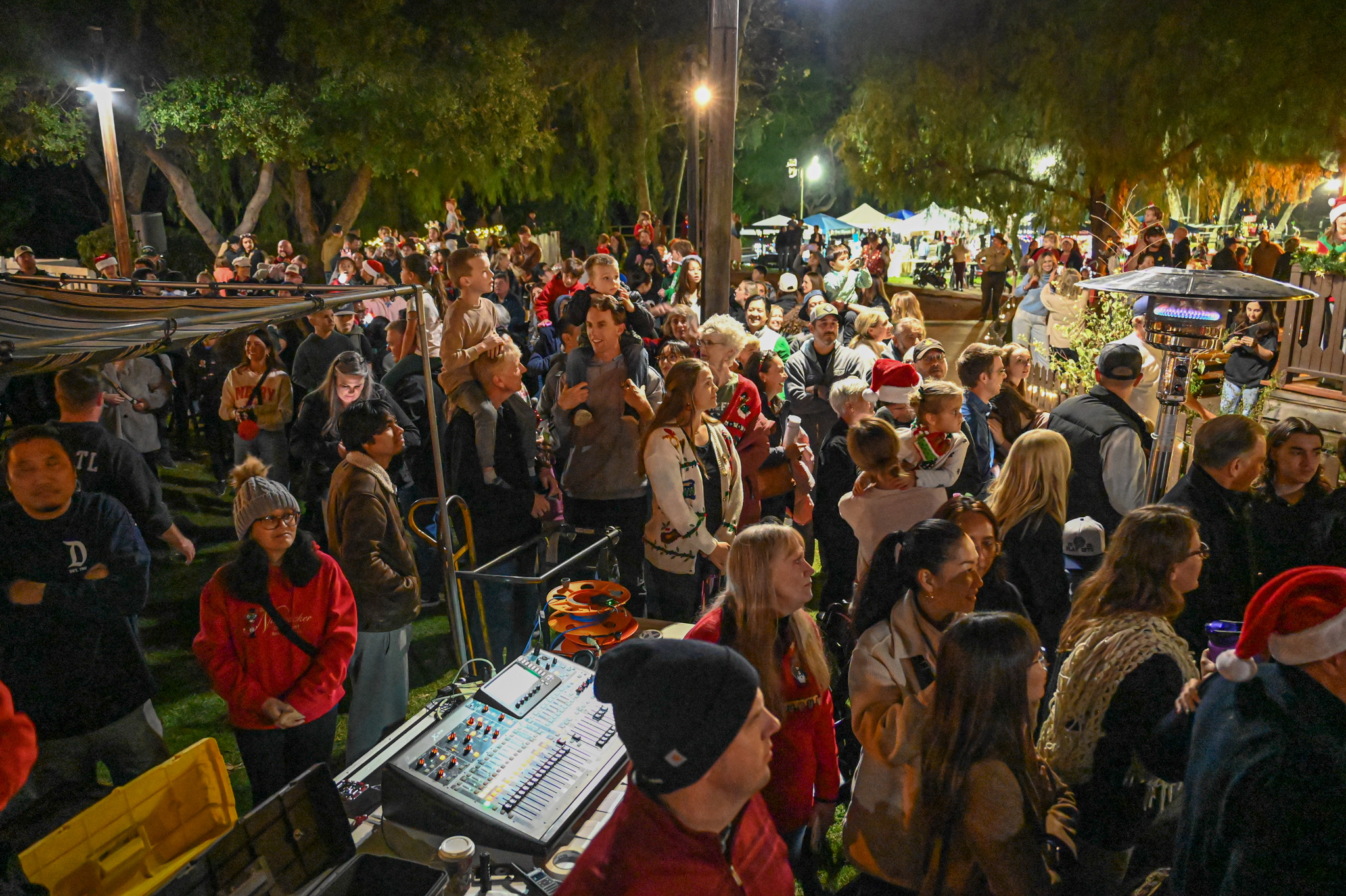 Hundreds of people were gathered throughout the Old Poway Park...