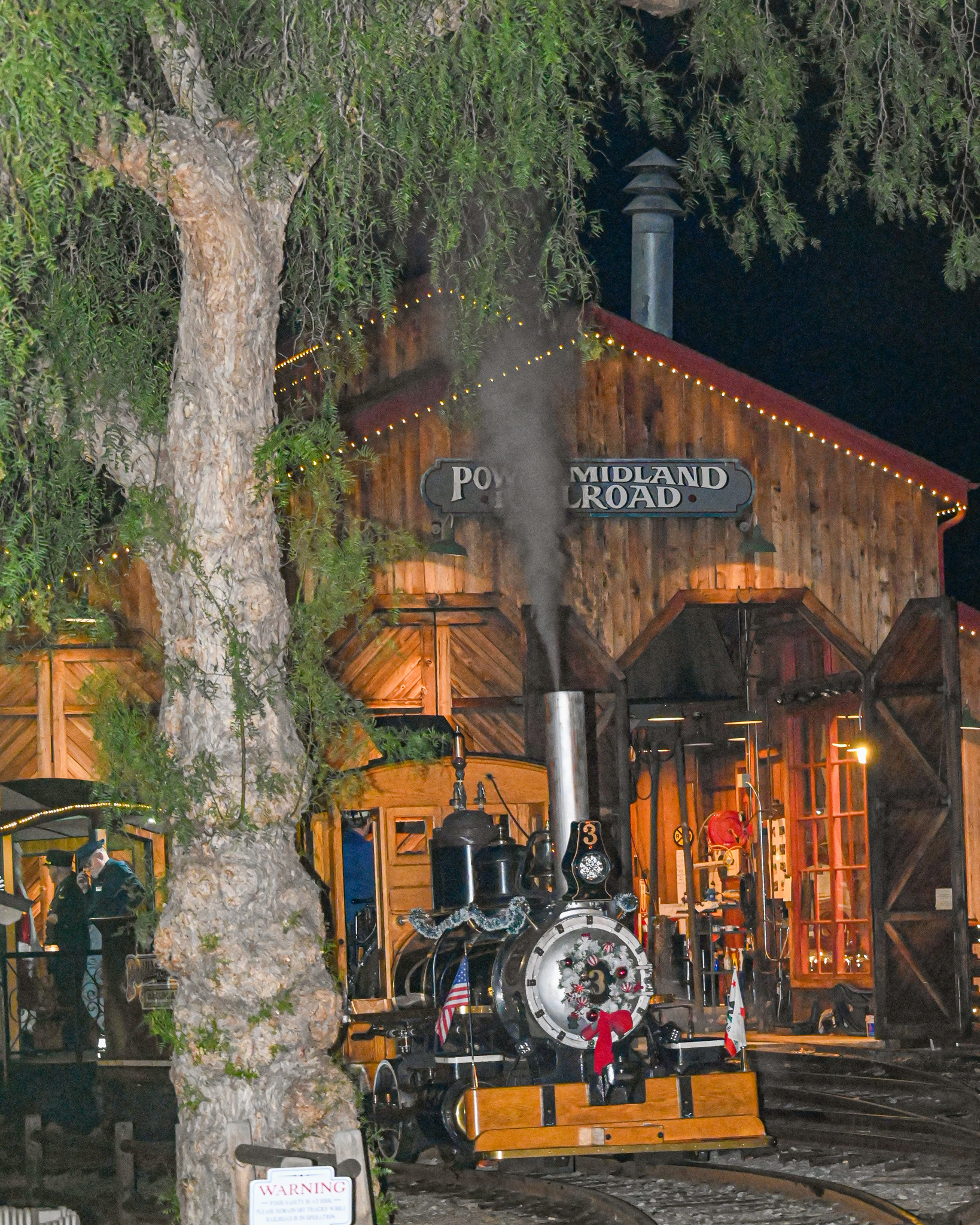 The Poway Midland Locomotive rounds the bend with Santa and...
