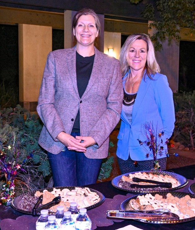 Kate Weihe with Human Resources and Risk Management and Patty Fletcher with the City Manager's office served cake and cookies at the celebration. (Criselda Yee)
