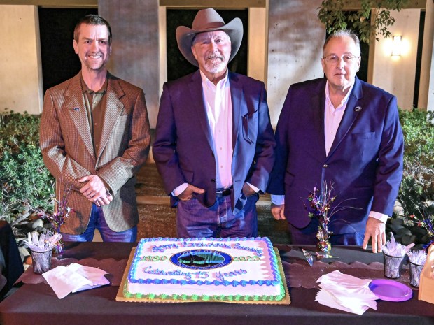 Poway City Councilmember Peter de Hoff, Mayor Steve Vaus and City Councilmember Christopher Pikus right before Vaus cut the celebration's cake. (Criselda Yee)