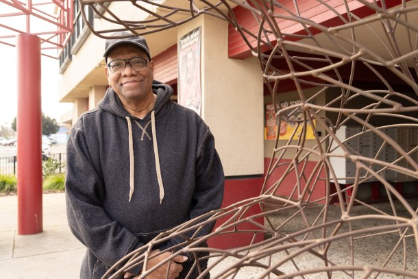 Aaron Boyce, executive director/marketing director for the Florin Square Community Development Corporation, the nonprofit arm that supports the business, cultural, and community development activities, stands by one of the shopping center’s many public art installations. Roberta Alvarado, OBSERVER