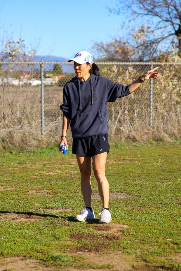 Katherine Pendergraph gives instructions to the 5K runners prior to the start of the First annual Candy Cane Run. (Stephanie Ogilvie) 